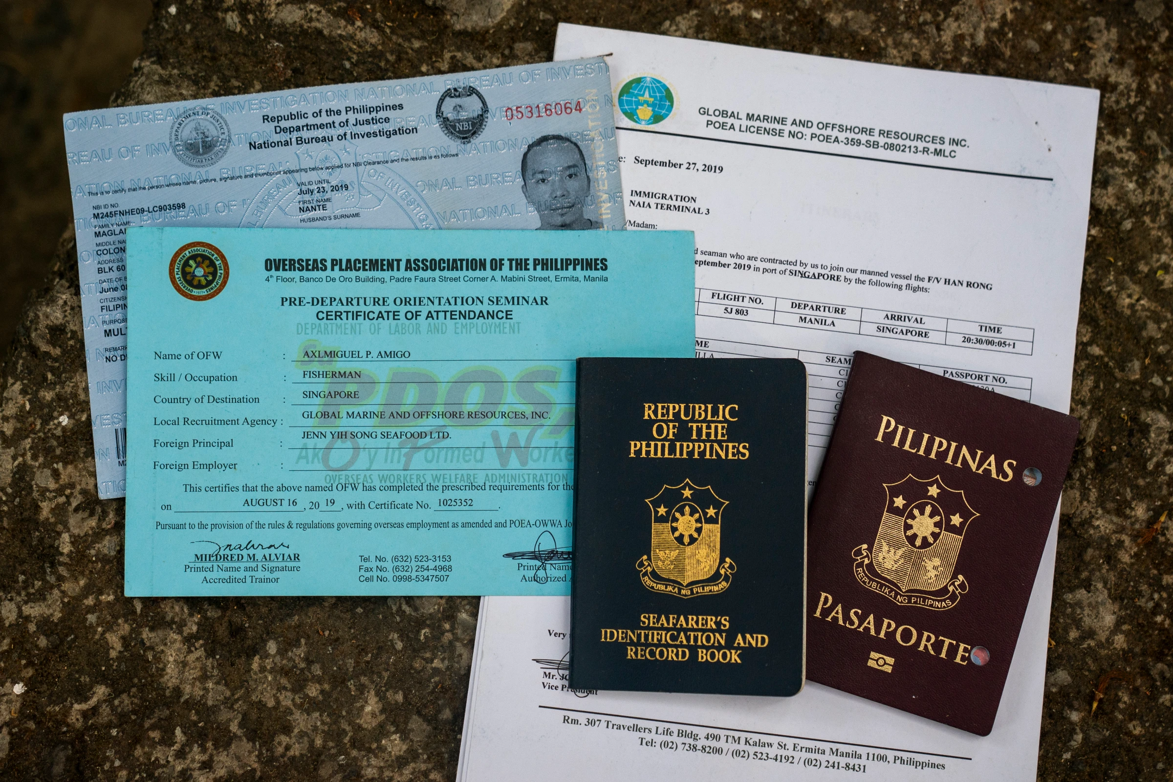 A view of the documents of Filipino fishermen during an interview in Manila, Philippines, May 6, 2025. Thomson Reuters Foundation/Lisa Marie David