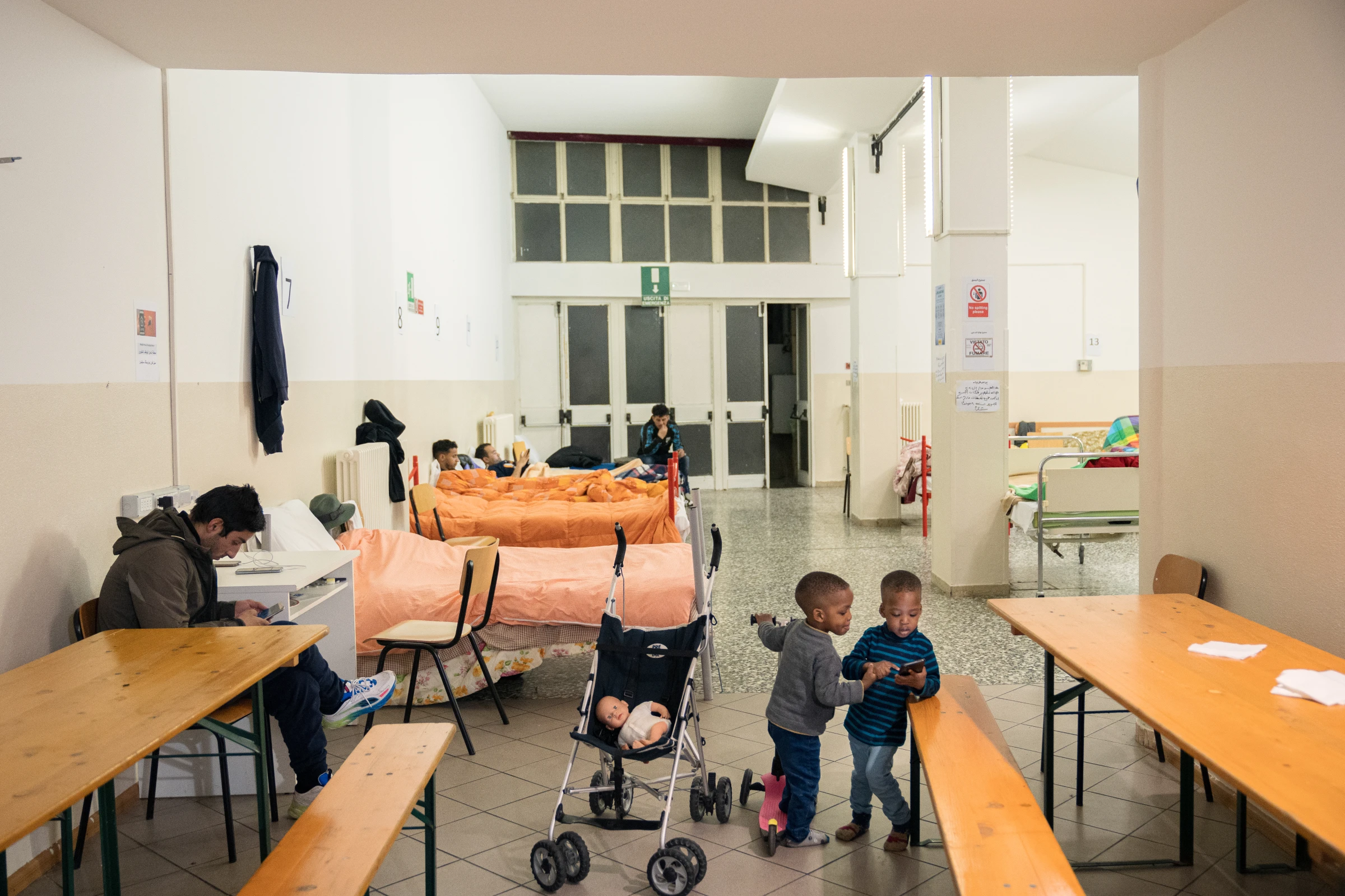 Children play in an emergency dormitory for people on the move in Trieste, Italy. March 4, 2024. Francesco Pistilli/International Rescue Committee/Handout via Thomson Reuters Foundation