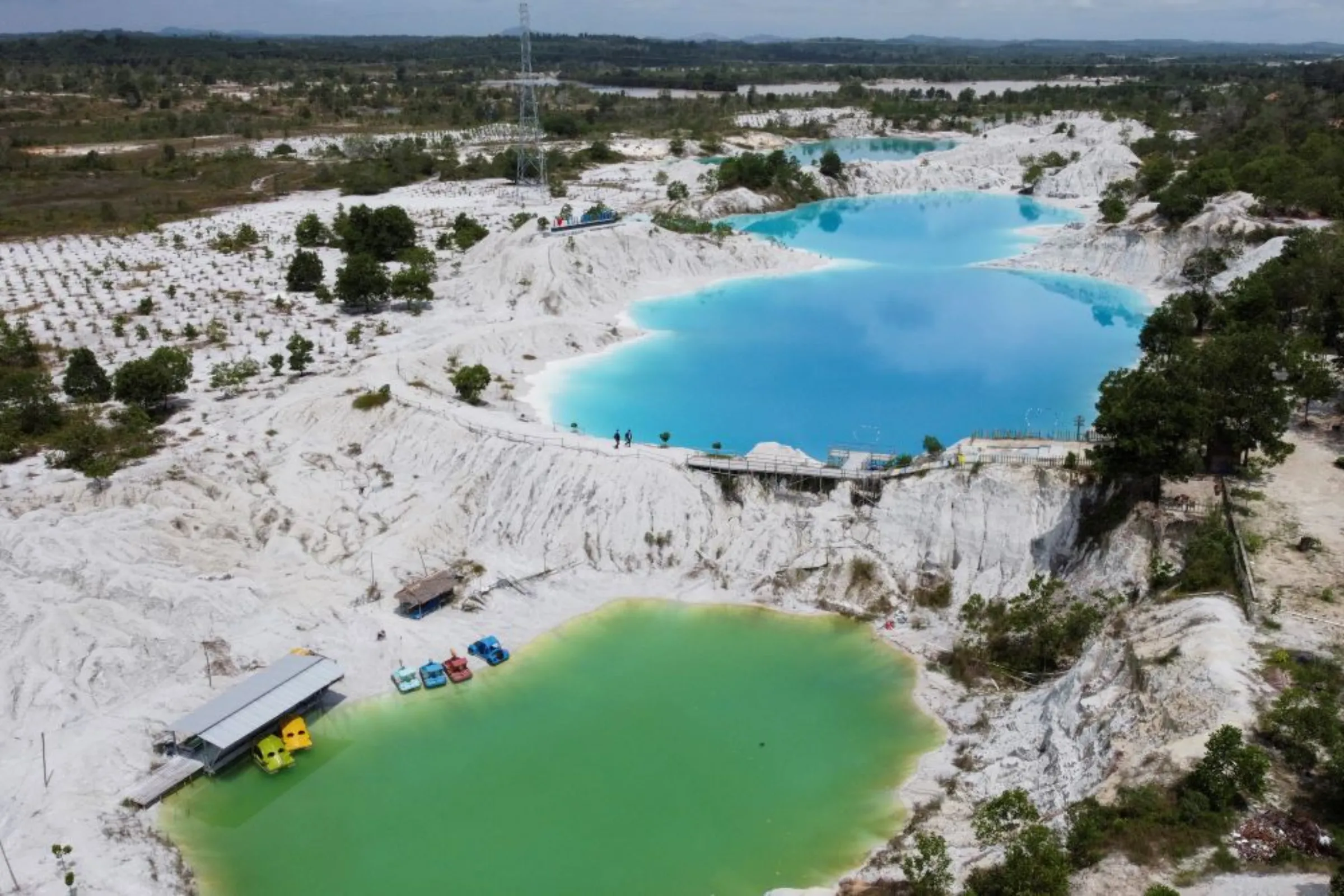 An aerial view shows a lake known as Kulong Biru (blue lake) in Koba, on the island of Bangka, Indonesia, May 2, 2021. Picture taken with a drone