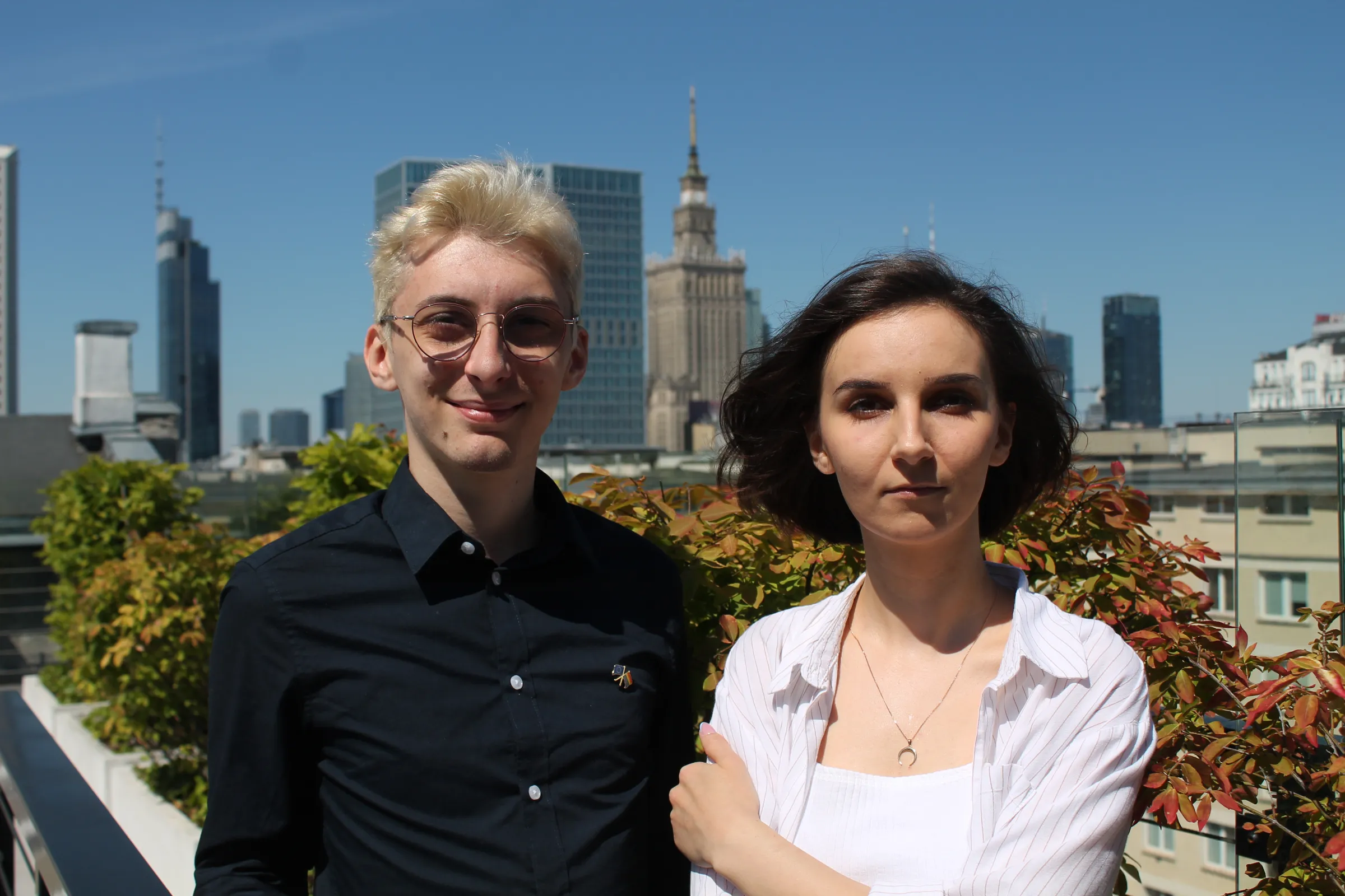 Dominik Kuc (left), founder of the first ranking of LGBTQ+ inclusion in Polish schools, and his colleague in the ranking project Agata Zapora (right) pose during an interview in Poland’s capital Warsaw on June 25, 2022