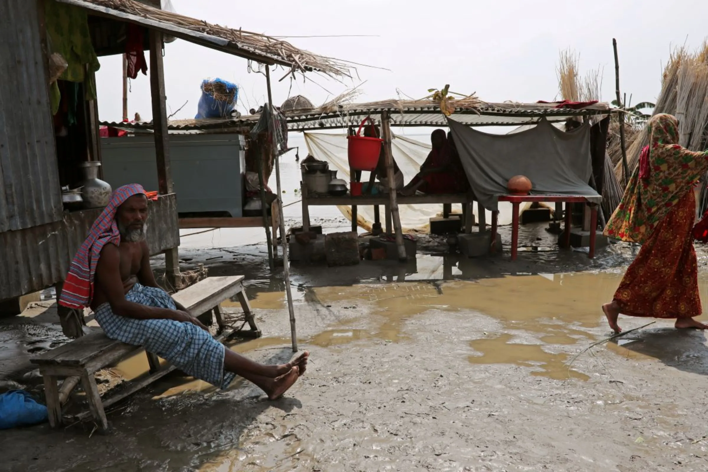 Flood-affected people are seen in a temporary shelter on a nearby dry land in Jamalpur, Bangladesh, July 21, 2019