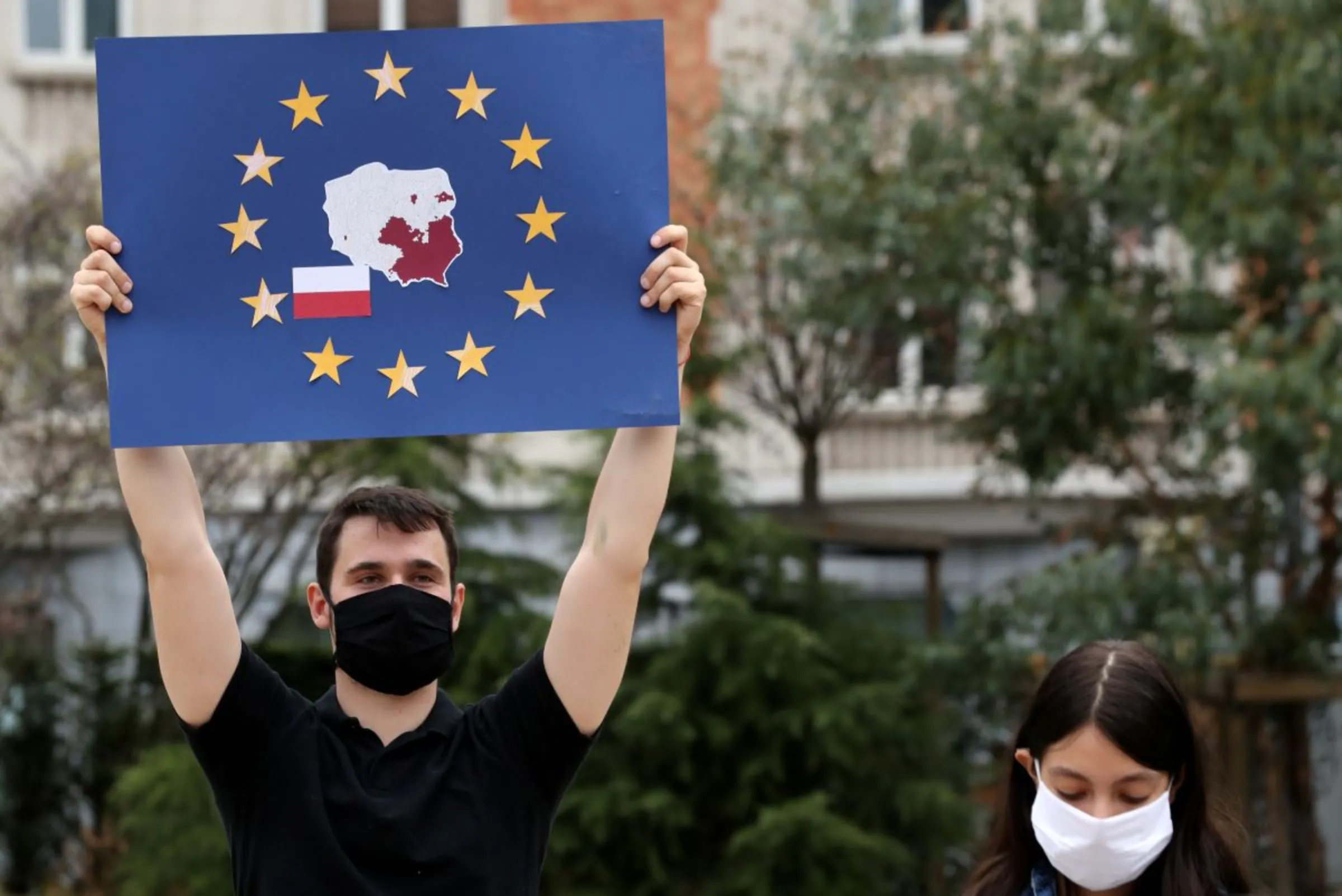 People gather outside the European Union institutions in solidarity with Poland's LGBT community, in Brussels, Belgium August 19, 2020. REUTERS/Yves Herman