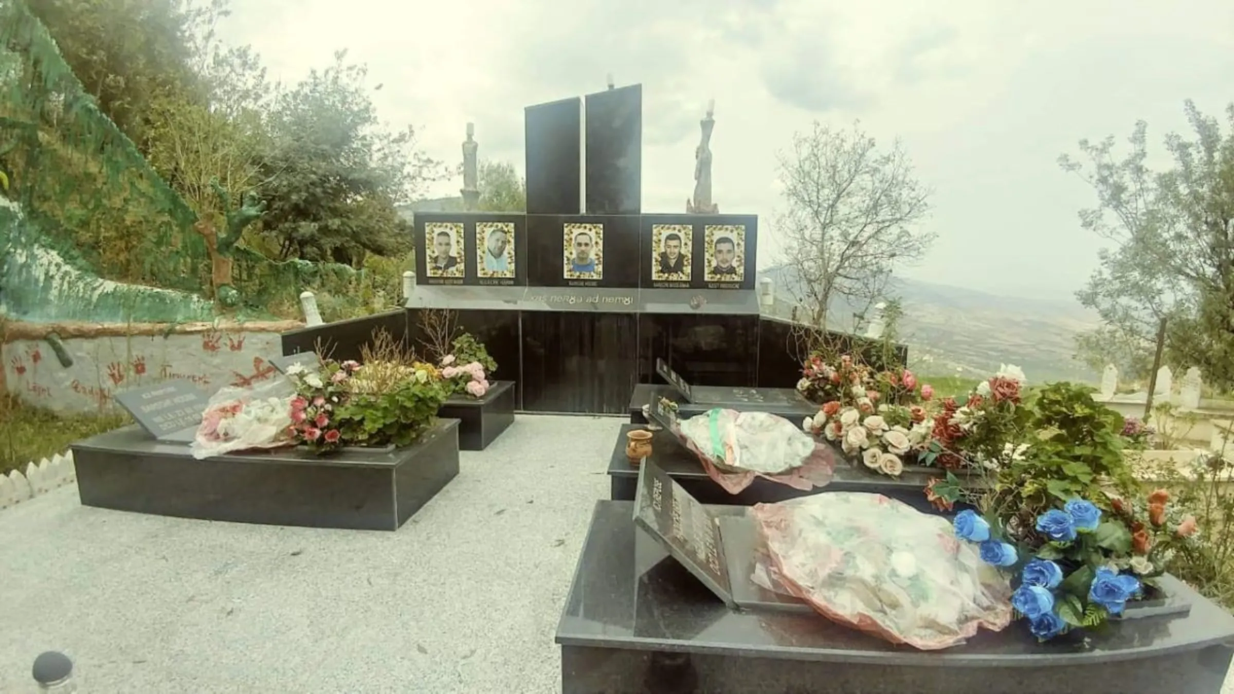 A burial site for five of at least 90 people killed in wildfires in 2021 in Tizi Ouzou, Algeria, 21 October, 2022. Madjid Serrah/Thomson Reuters Foundation