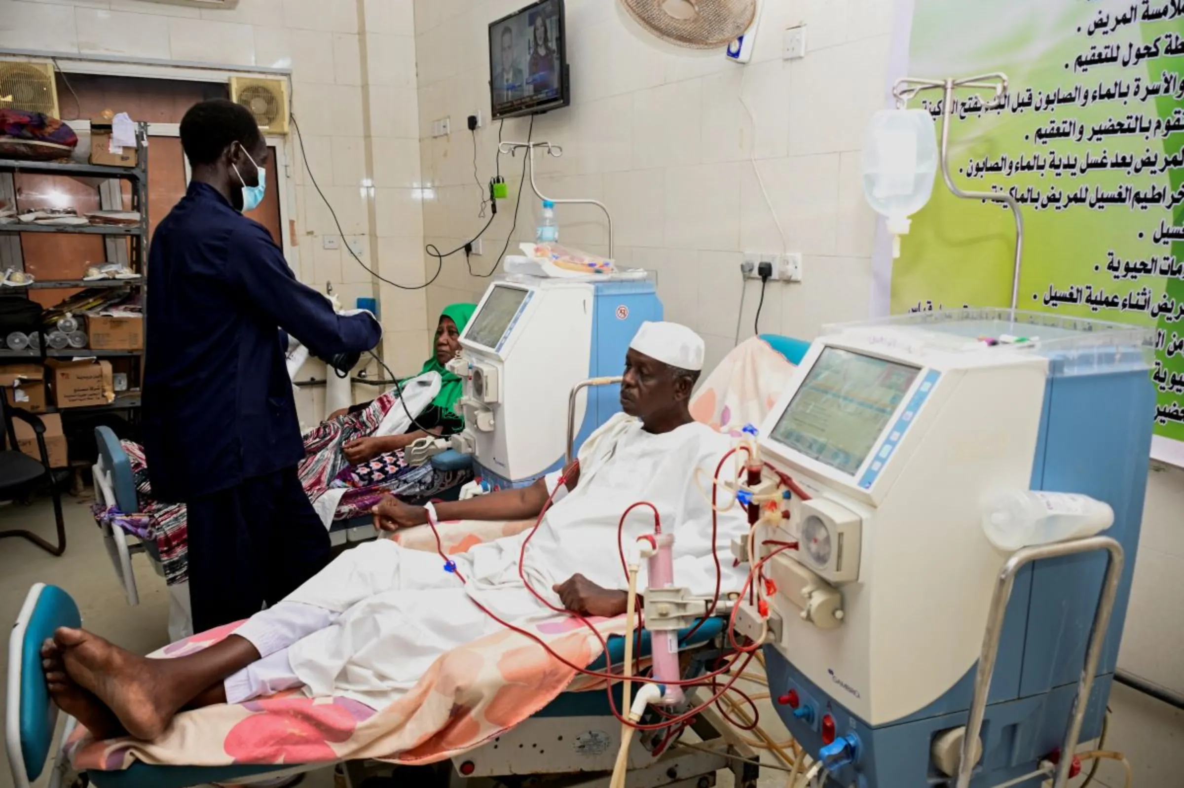 A Sudanese family waits at a hospital in Khartoum, Sudan, August 20, 2023