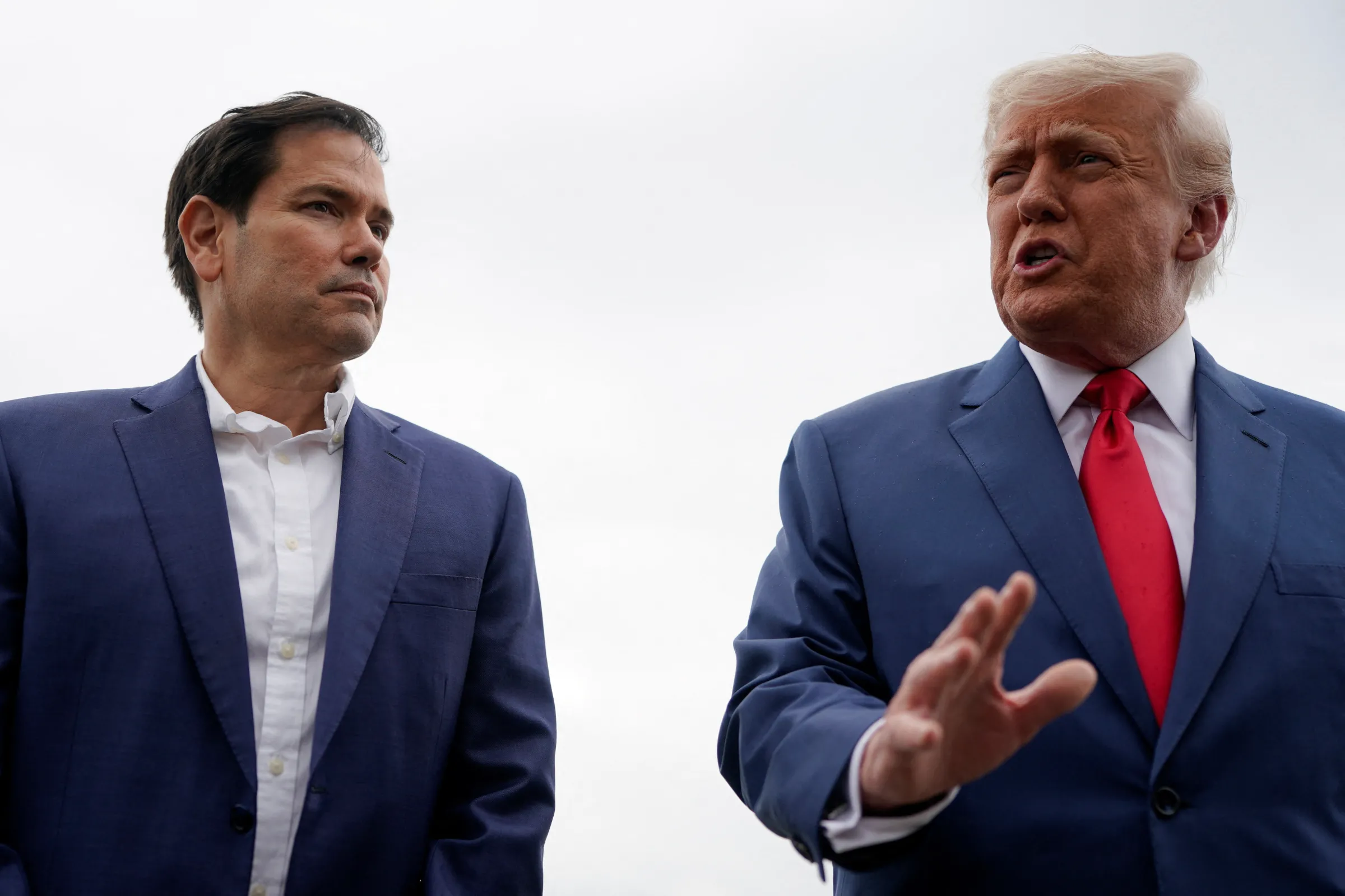 U.S. President Donald Trump stands with U.S. Secretary of State Marco Rubio in Morristown, New Jersey, U.S., June 8, 2025. REUTERS/Nathan Howard