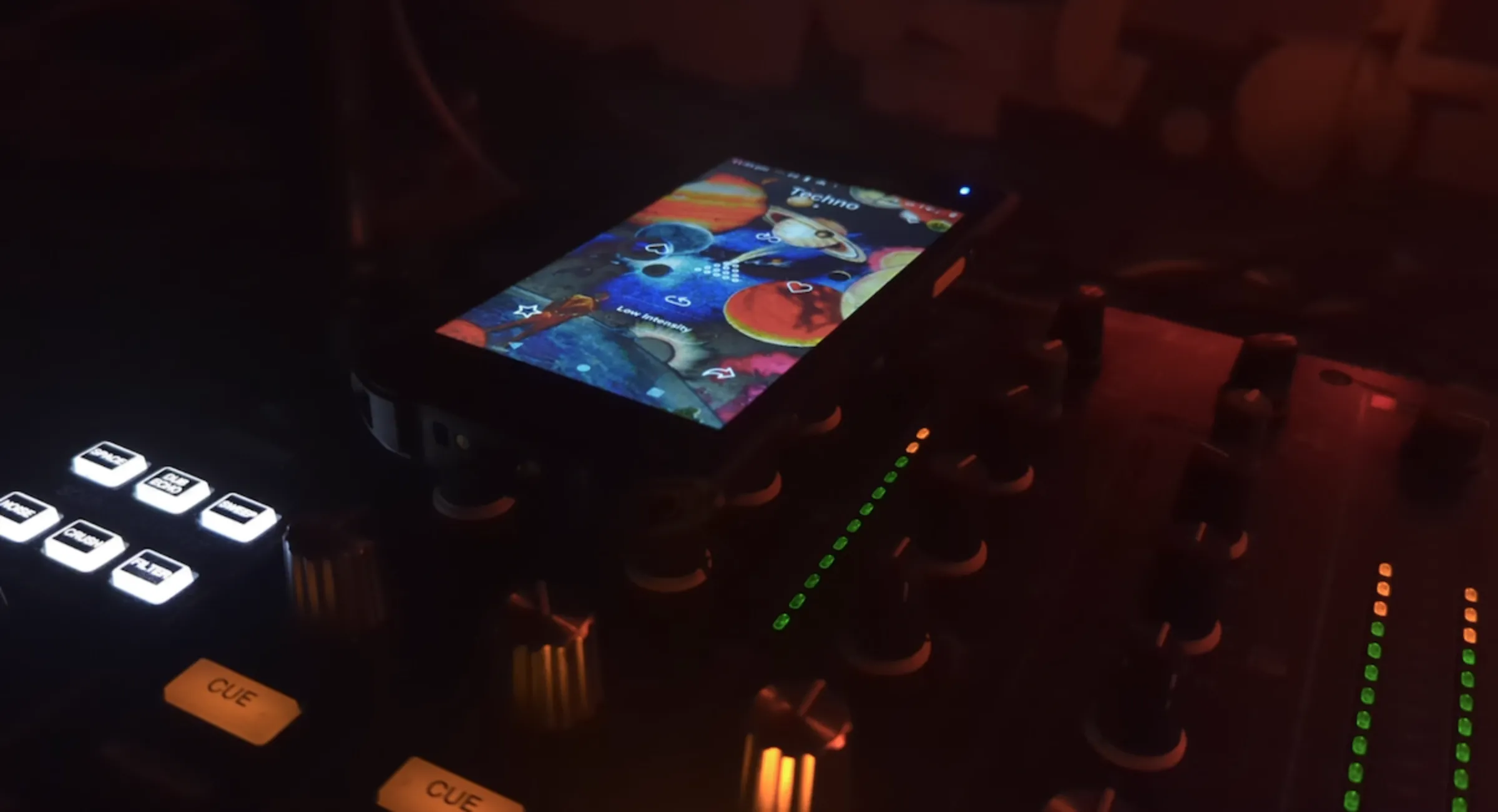 The Mubert app playing techno music on top of a sound mixing board at a rave in London, February 17, 2023. Thomson Reuters Foundation/Adam Smith