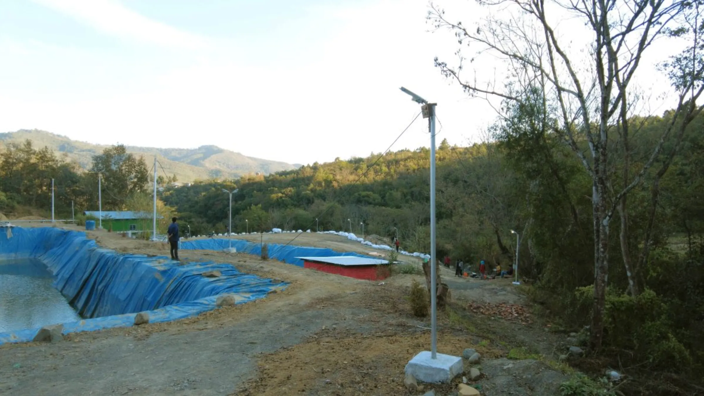 Street lights through the solar-driven pumped storage hydropower project in the Hengbung village of Manipur, India, August 23, 2022