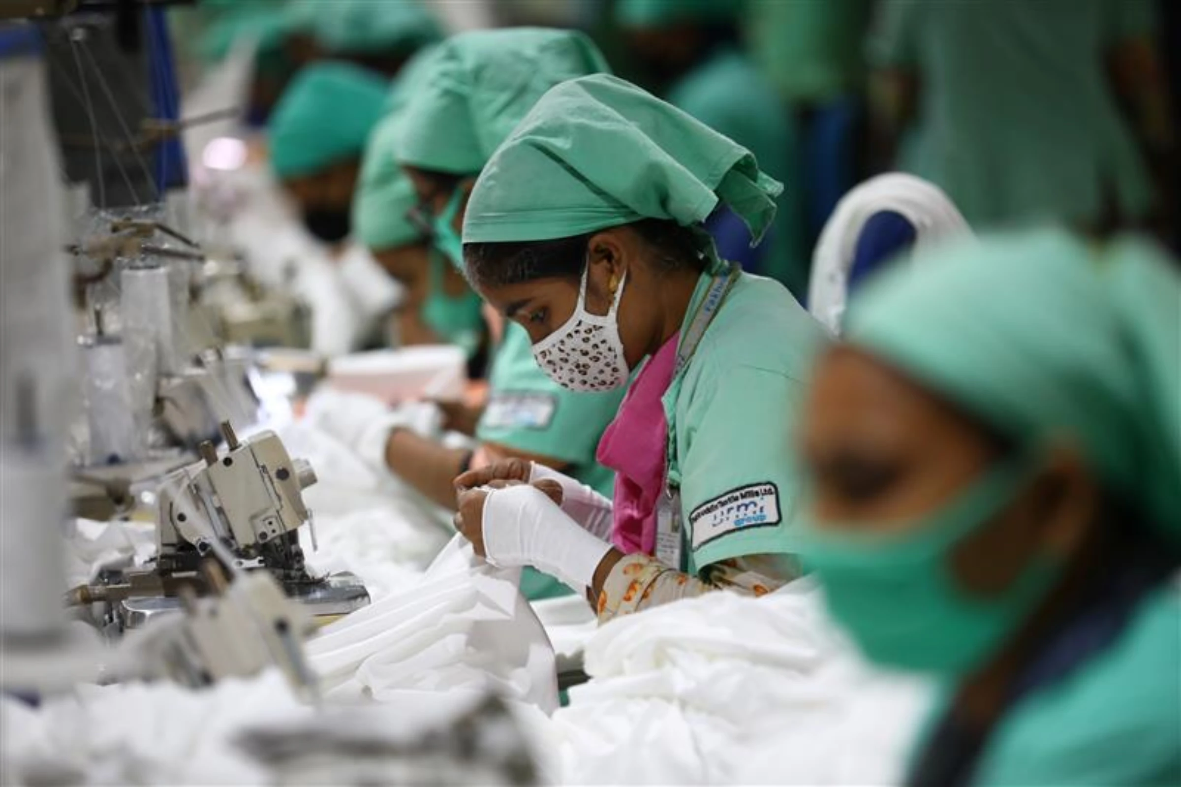 Garment employees work in a sewing section of the Fakhruddin Textile Mills Limited in Gazipur, Bangladesh, February 7, 2021. REUTERS/Mohammad Ponir Hossain