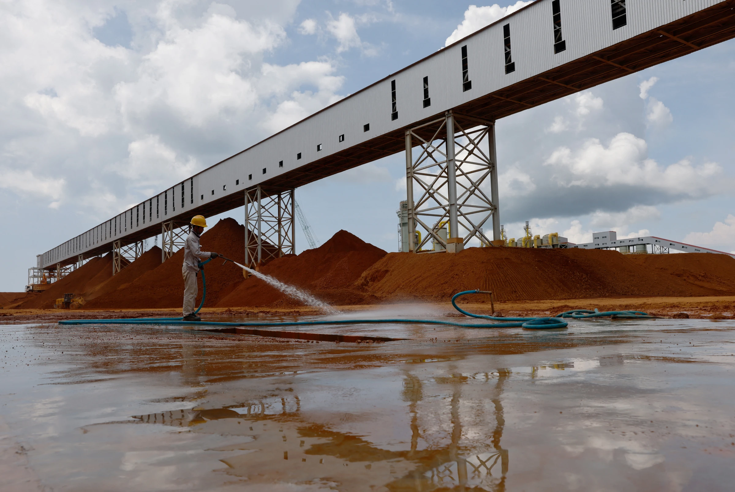 Mounds of bauxite are stored at Shandong Nanshan Aluminium's integrated aluminium plant in Bintan, Indonesia May 5, 2023. REUTERS/Edgar Su