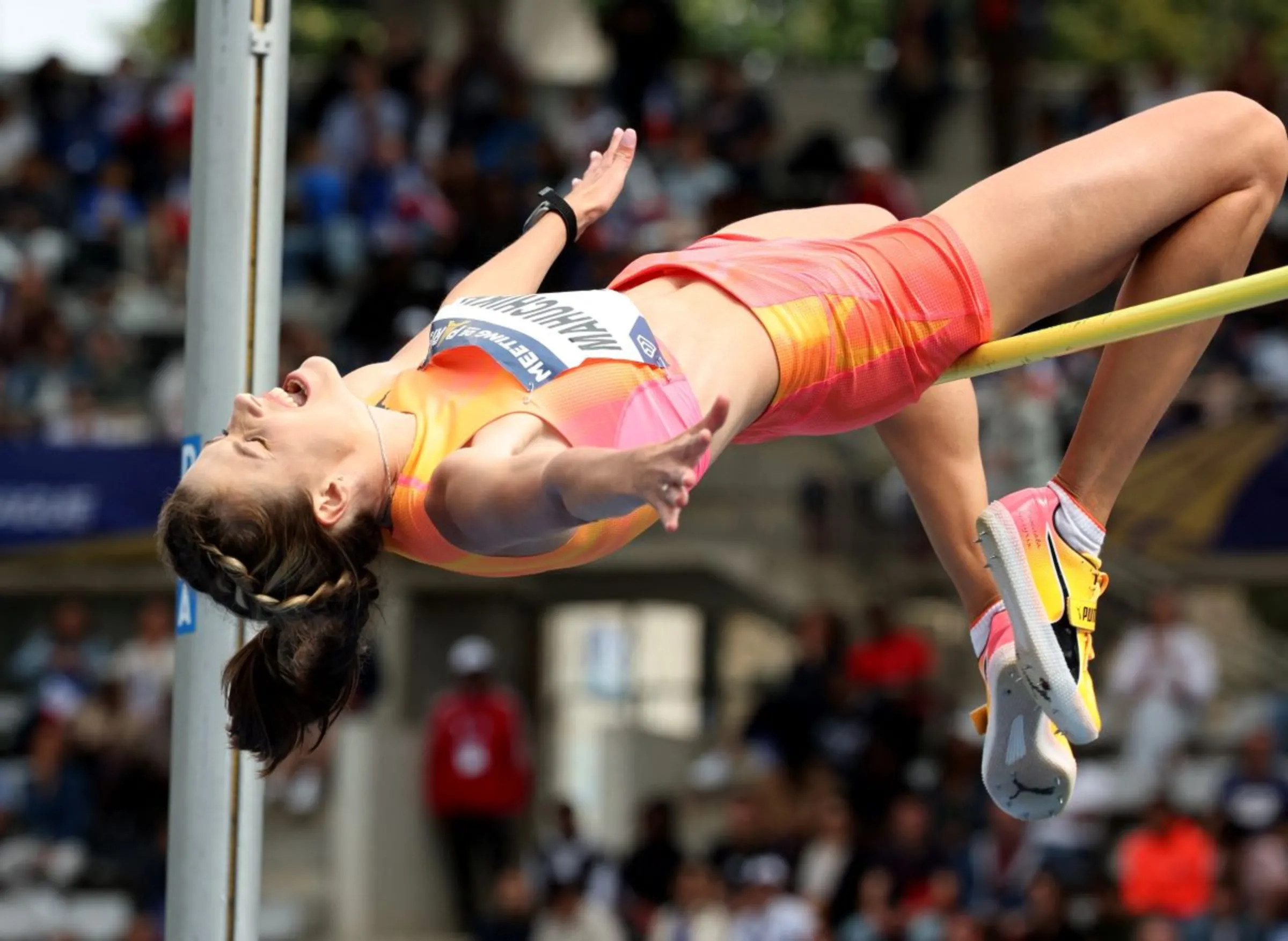 Ukraine's Yaroslava Mahuchikh - coached by Tetyana Stepanova - competes in the women's high jump at the Diamond League in Paris, July 7, 2024. REUTERS/Manon Cruz