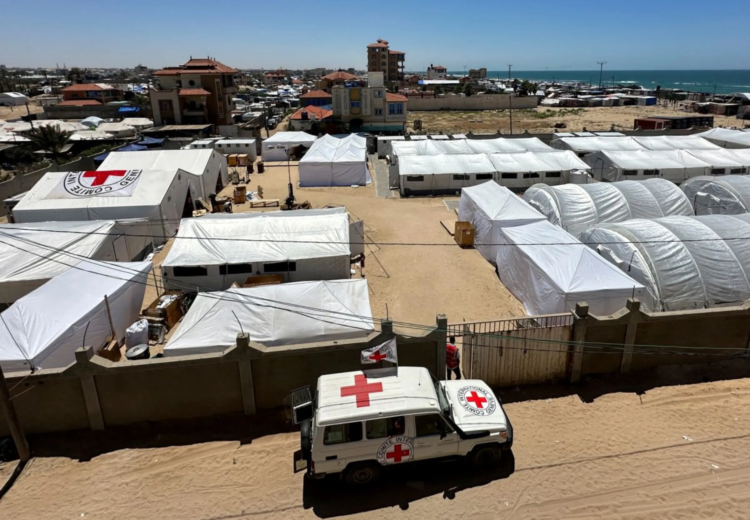 A vehicle is parked near the International Red Cross field hospital in the southern Gaza Strip, May 16, 2024. REUTERS/Doaa Rouqa