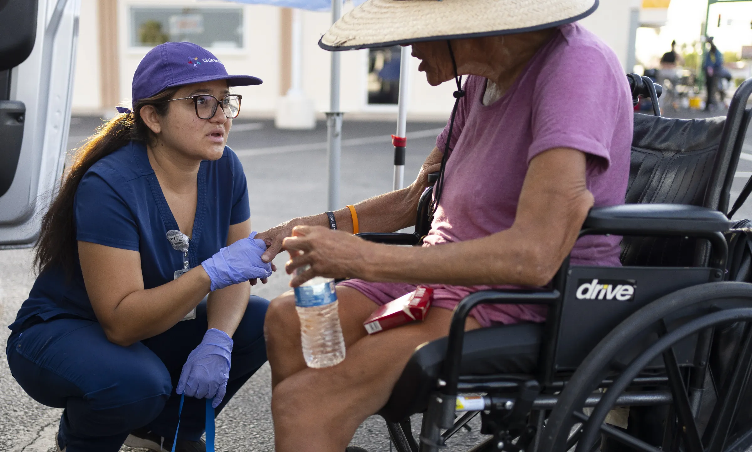 Circle the City medic Perla Puebla reassures Maurajean Bunn after her medical examination. July 15, 2024. Thomson Reuters Foundation/Rebecca Noble