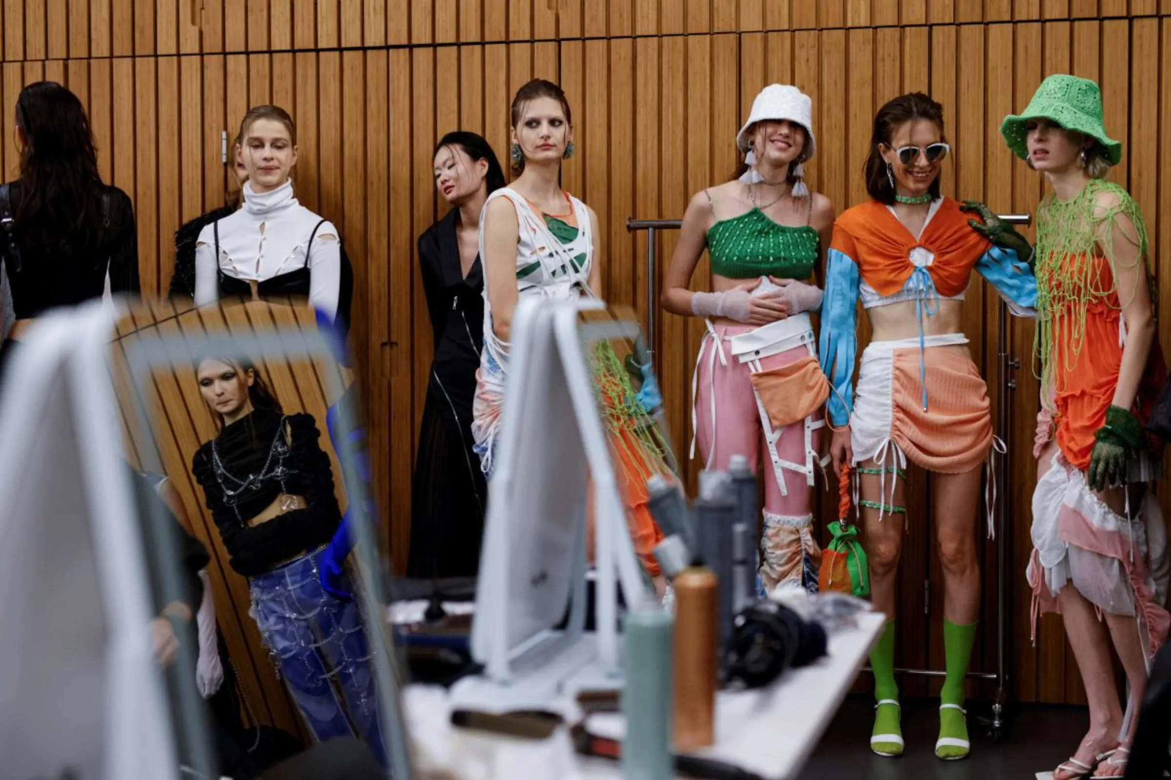 Models wait at the backstage before the 'Fashion X AI : Call For Young Talents 2022' fashion show in Hong Kong, China, December 19, 2022. REUTERS/Tyrone Siu