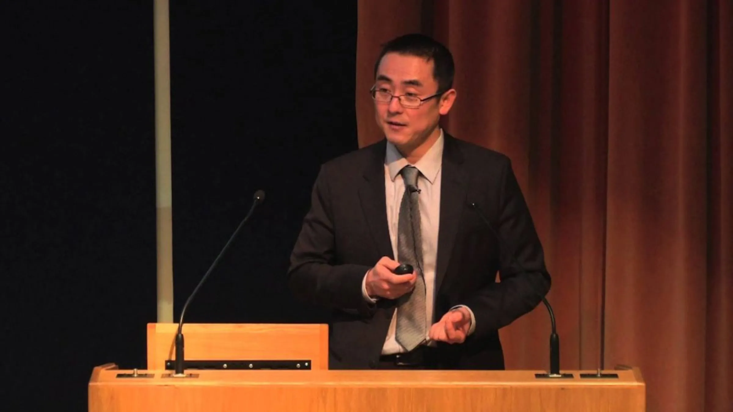 Tomoya Obokata gives a lecture on international law on human trafficking at Keele University in northern England, 25 March, 2013. Handout via Thomson Reuters Foundation