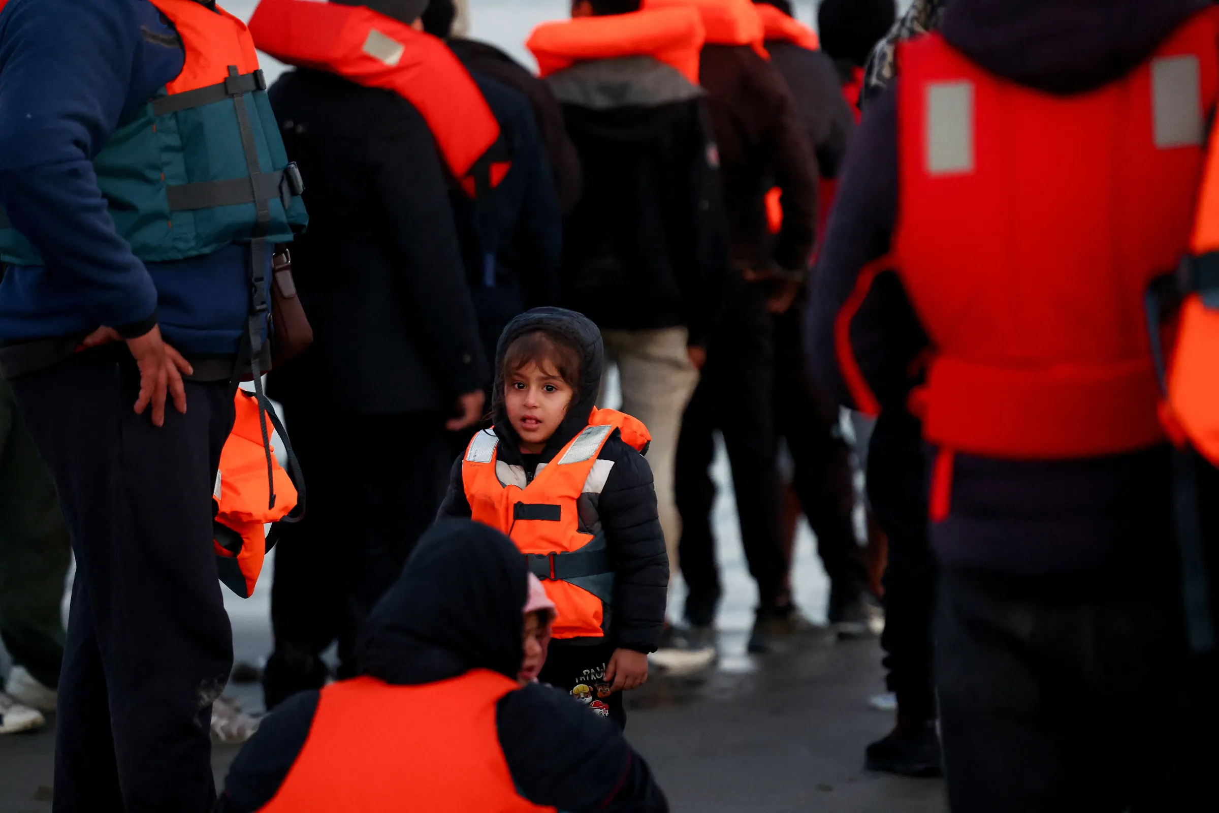 Migrants gather before trying to board an inflatable dinghy leaving the coast of northern France in an attempt to cross the English Channel to reach Britain, from the beach of Petit-Fort-Philippe in Gravelines, near Calais, France, September 27, 2025. REUTERS/Abdul Saboor