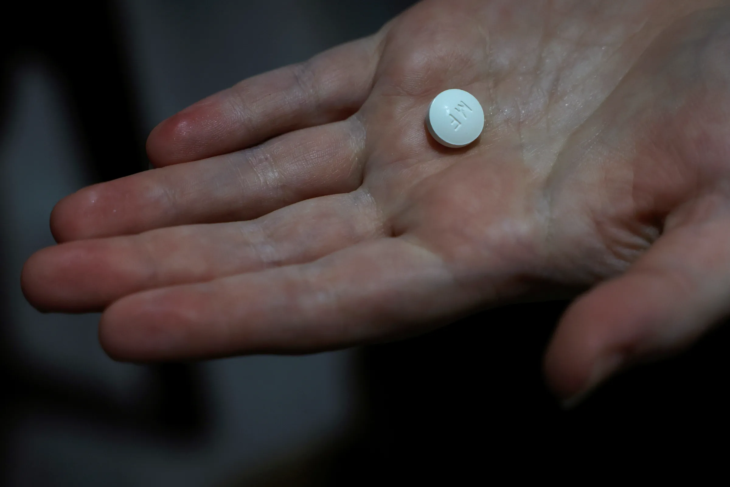 A patient prepares to take Mifepristone, the first pill in a medical abortion, at Alamo Women's Clinic in Carbondale, Illinois, U.S., April 9, 2024. REUTERS/Evelyn Hockstein