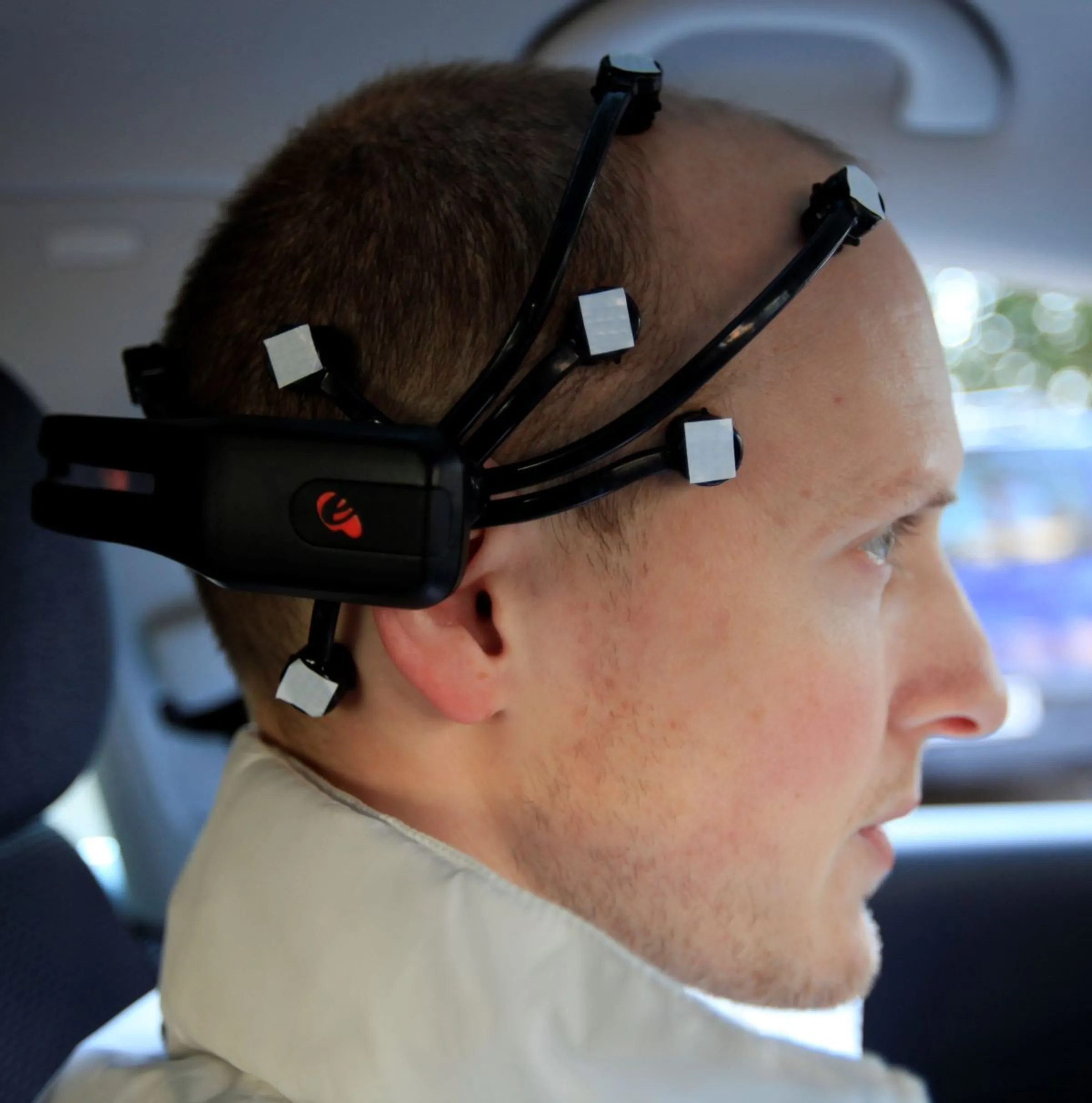A member of the AutoNOMOS research team of the Artificial Intelligence Group at the Freie Universitaet (Free University) wears a Emotiv Epoc device as he demonstrates a hands-free driving of the research car named 'MadeInGermany' during a test in Berlin, February 28, 2011. REUTERS/Fabrizio Bensch