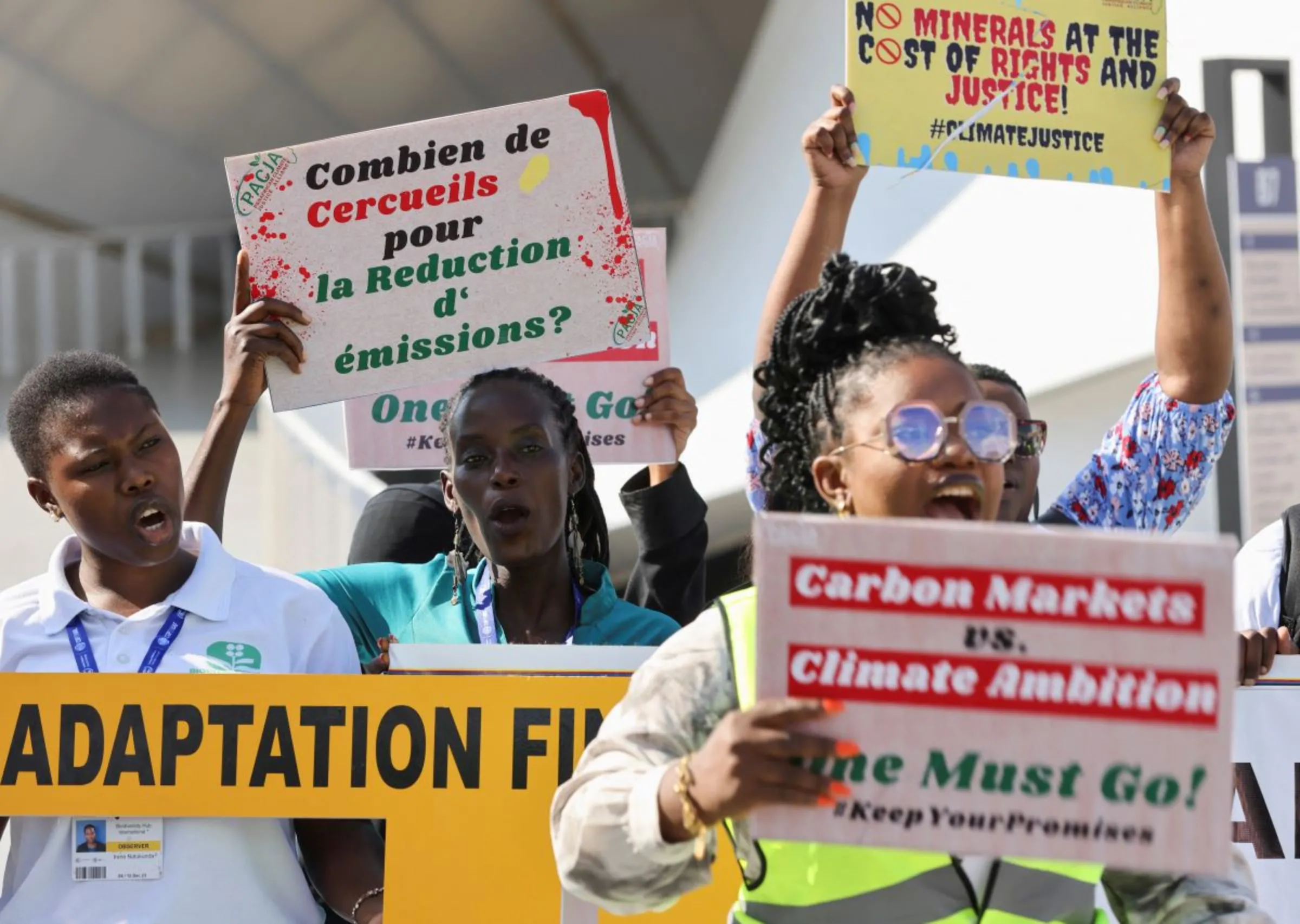 Activists hold placards and shout slogans during a protest, at the United Nations Climate Change Conference COP28 in Dubai, United Arab Emirates, December 6, 2023