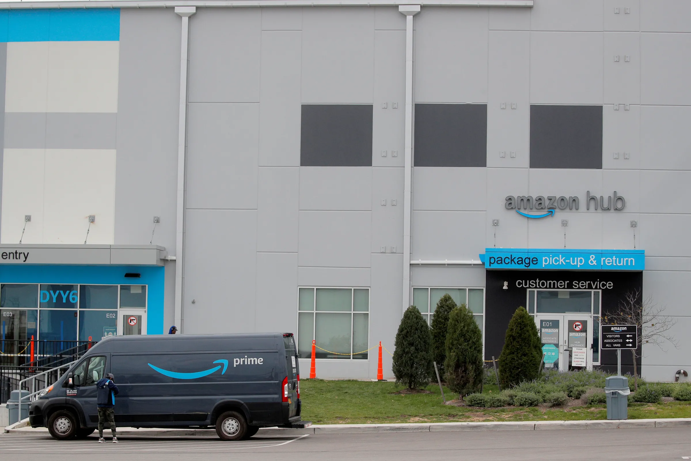 An Amazon delivery truck parks in front of the company's package pick-up and return point in Staten Island, New York, U.S. November 25, 2020. REUTERS/Brendan McDermid