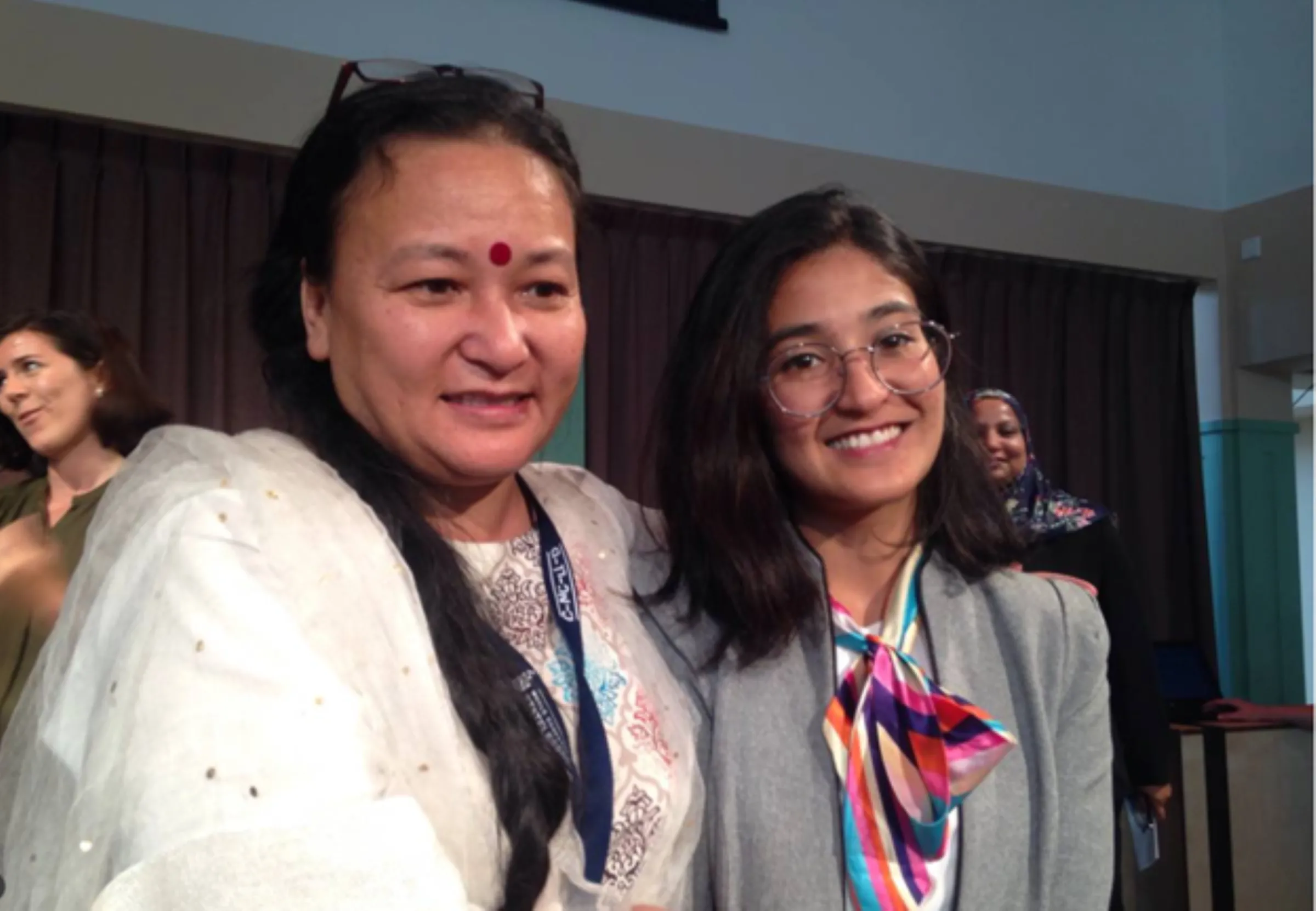Neha Gurung, who is campaigning to end discriminatory nationality laws in Nepal, is pictured with her mother Deepti Gurung at the 2019 World Conference on Statelessness in The Hague. Thomson Reuters Foundation/Emma Batha