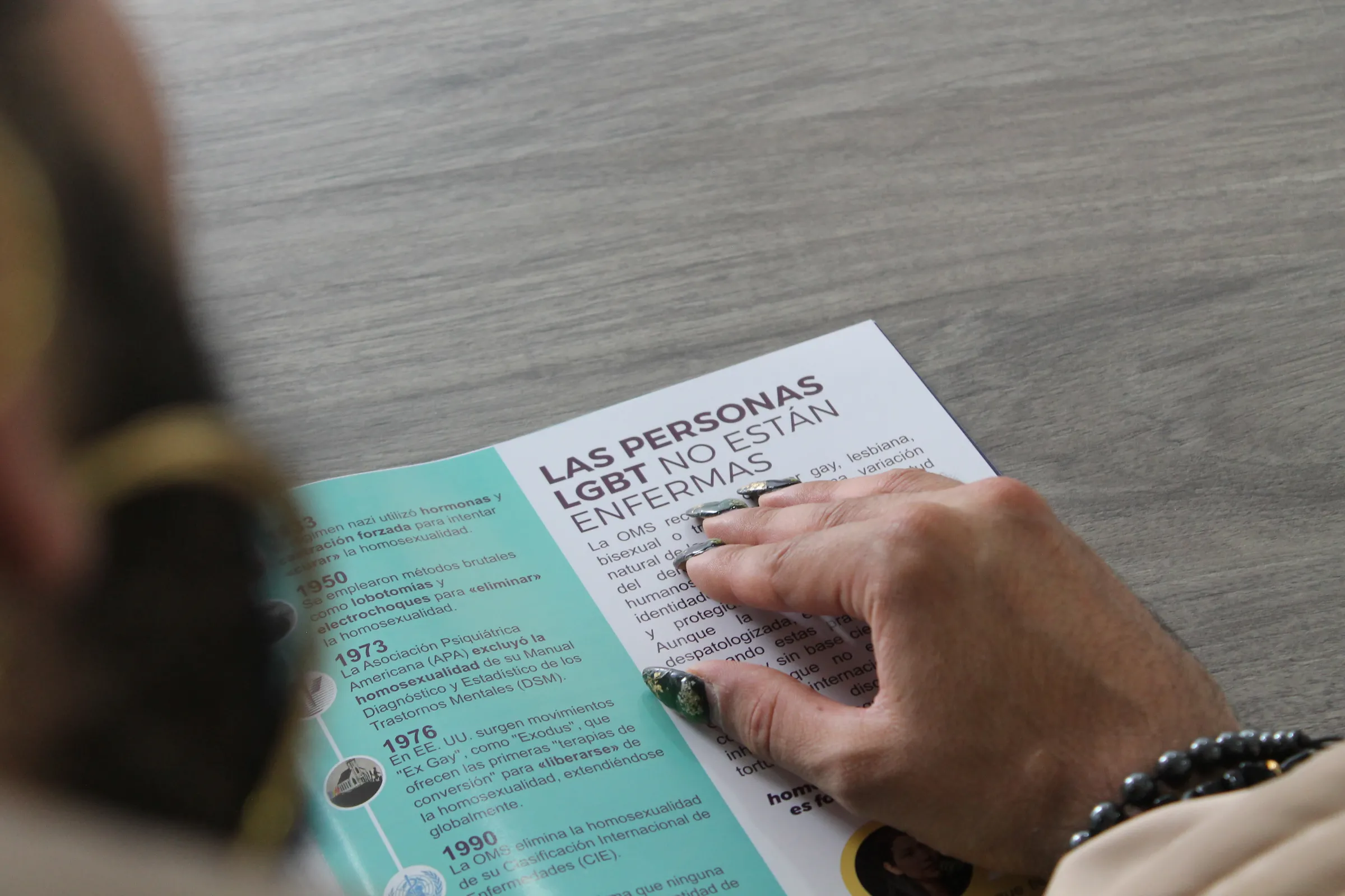 Colombian trans activist Danne Belmont shows a brochure of the campaign to ban so-called 'conversion therapy' in the South American country at the offices of the LGBTQ+ rights group Fundación GAAT in Bogotá, on July 24, 2025. Thomson Reuters Foundation/Enrique Anarte