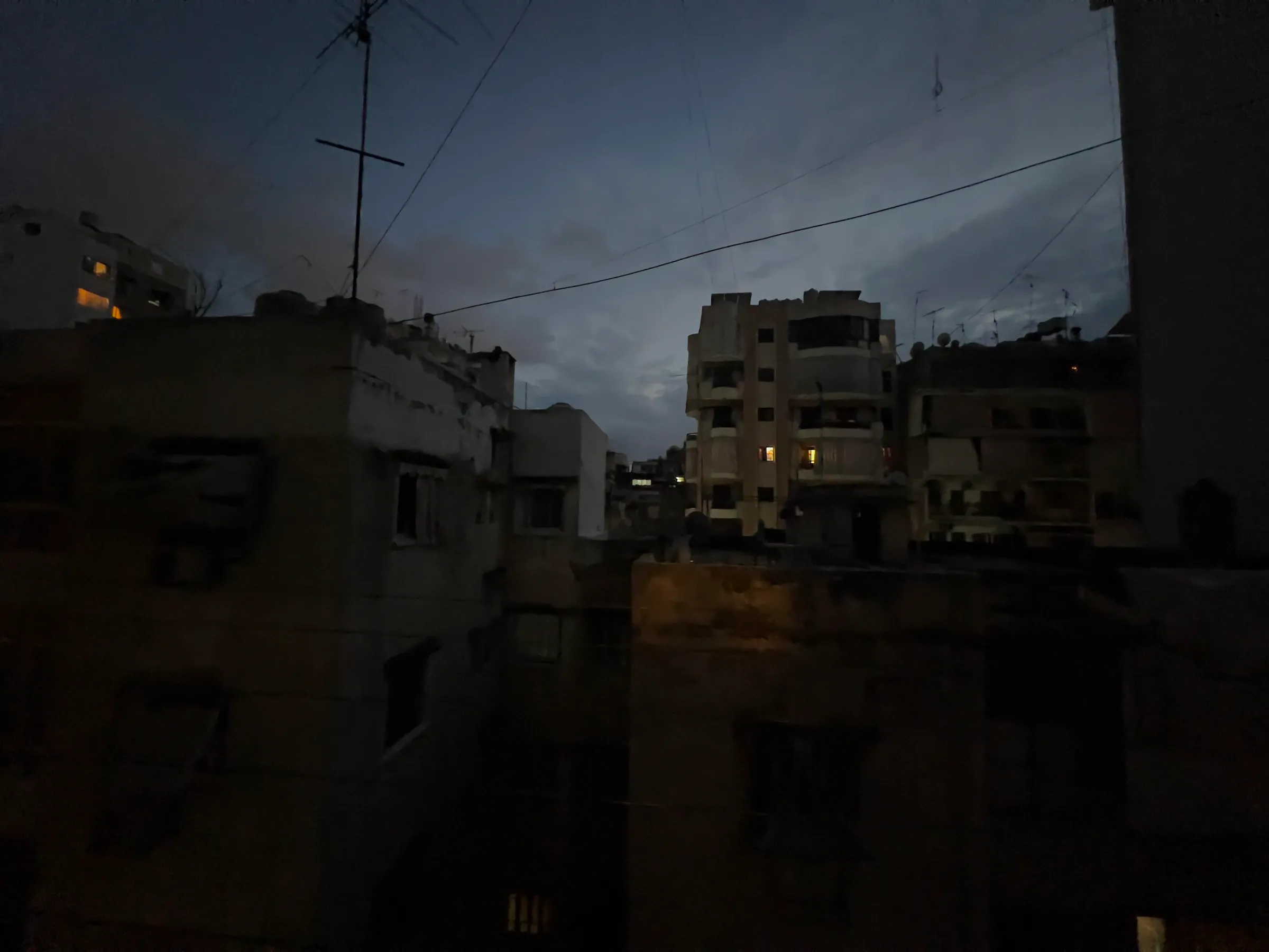 A rooftop in Beirut plunged into darkness as the country faces constant power shortages. Beirut, Lebanon. November 16, 2022. Thomson Reuters Foundation/Tala Ramadan