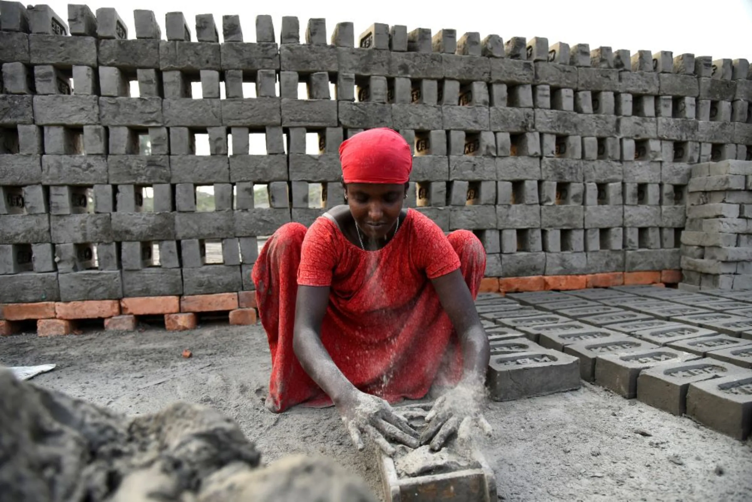 A labourer makes bricks in a kiln at Langolpota village in North 24 Parganas district in the eastern state of West Bengal, India, November 26, 2019