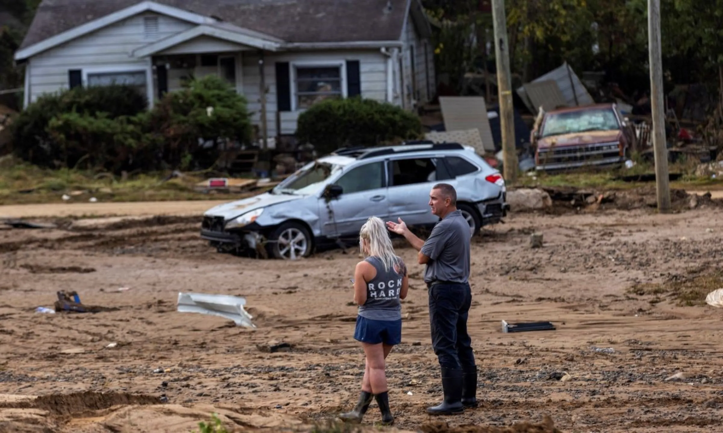 People look at the destruction following the passing of Hurricane Helene, in Swannanoa, North Carolina, U.S., October 3, 2024. REUTERS/Eduardo Munoz