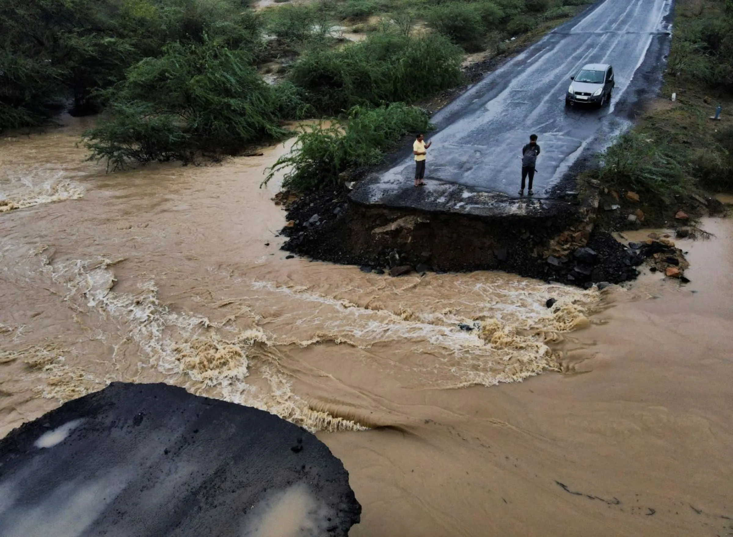 A drone view of a broken bridge, after Cyclone Biparjoy made landfall, along the Naliya-Bhuj highway, in the western state of Gujarat, India, June 16, 2023