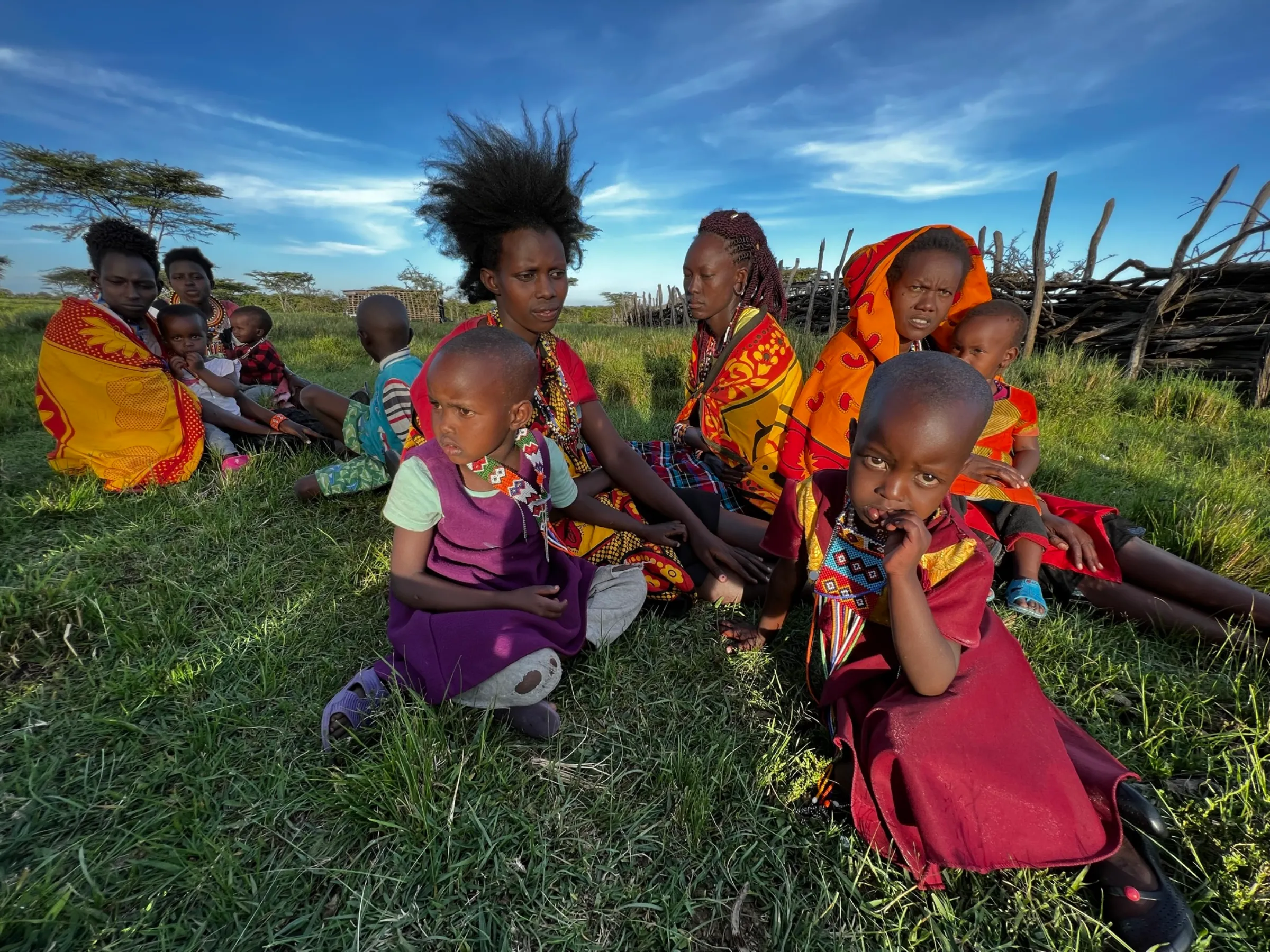 Maasai women and children at Oloisukut Conservancy, bordering the Maasai Mara National Reserve, in Kenya on Sept 27 2022. THOMSON REUTERS FOUNDATION/Nita Bhalla