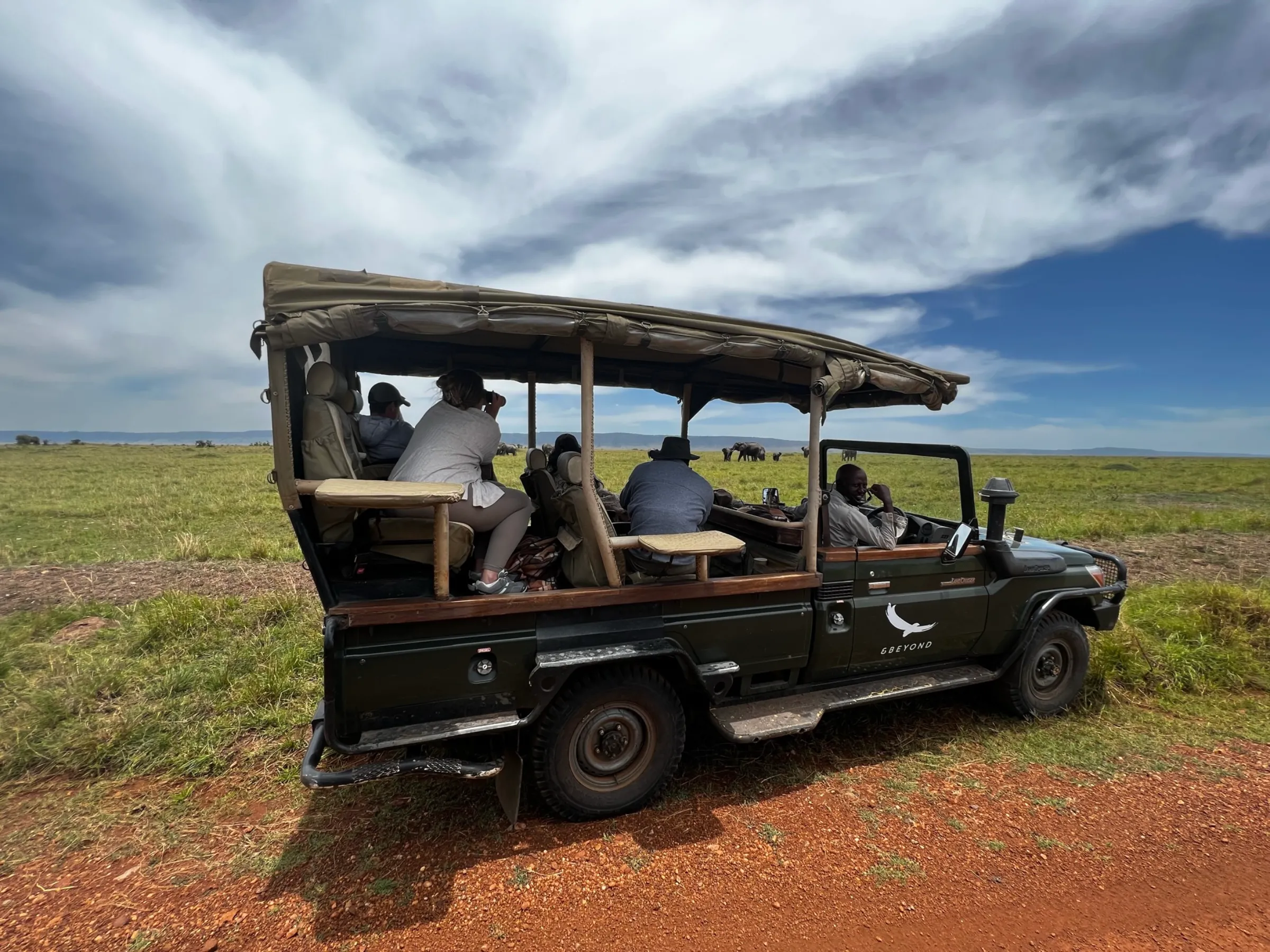 Tourists view a herd of elephants at the Maasai Mara National Reserve, in Kenya on Sept 28 2022. THOMSON REUTERS FOUNDATION/Nita Bhalla