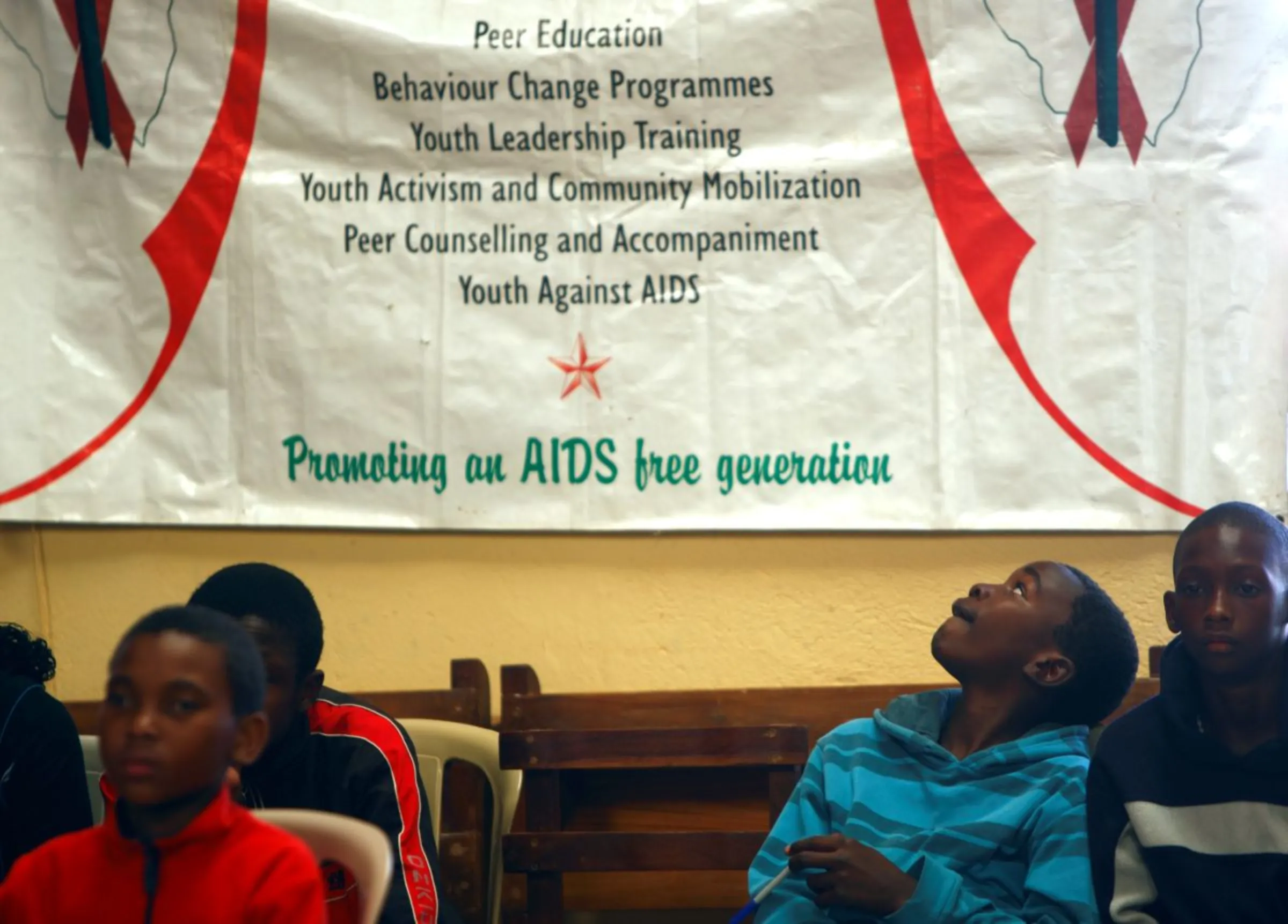 Participants take part in a group session at a Youth Against AIDS training camp organised by the Jesuit AIDS Project in Domboshawa, around 80 km (49 miles) north-east of Harare, April 13, 2012. REUTERS/Darrin Zammit Lupi