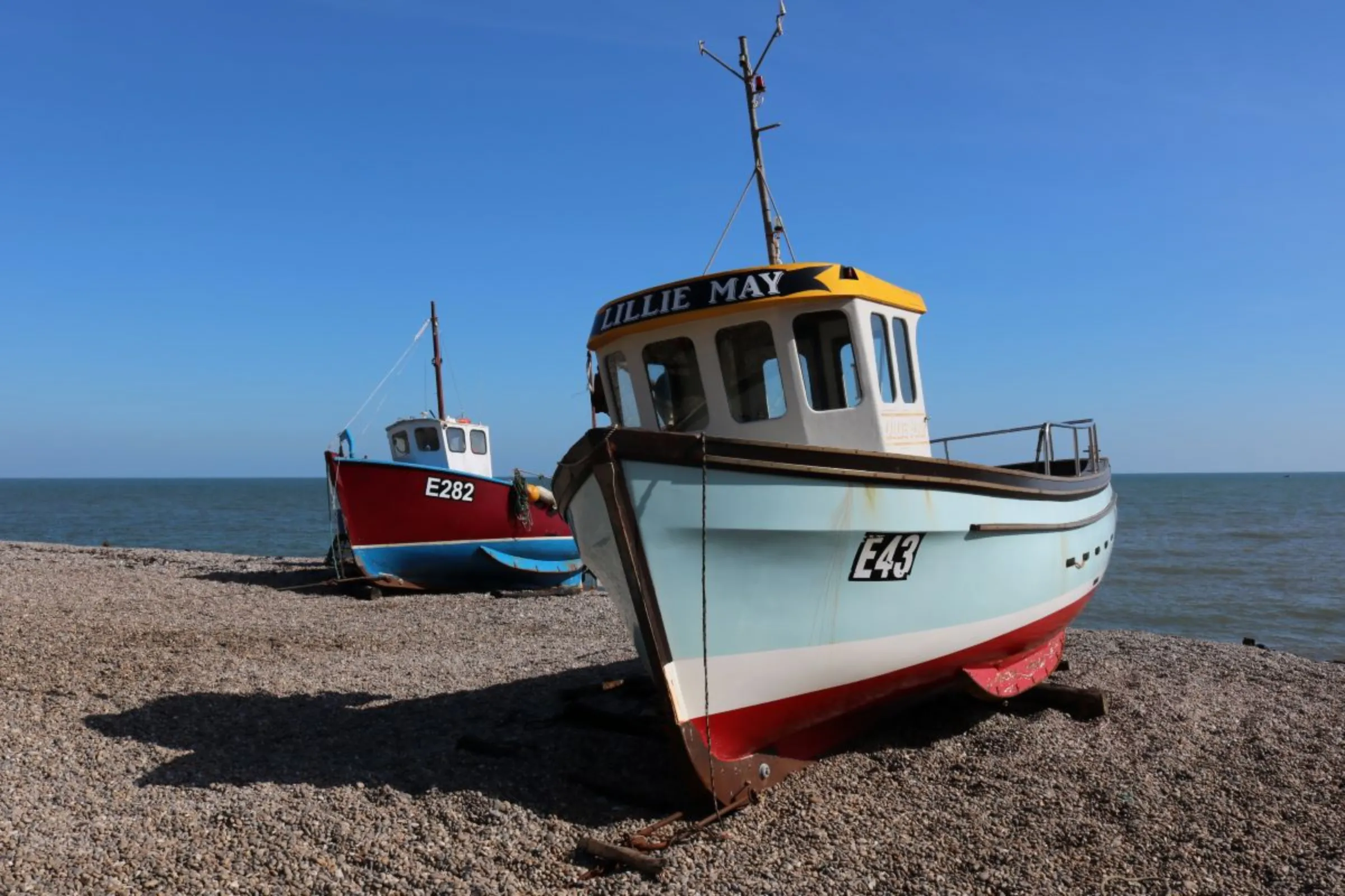 Fishing boats on the beach at Beer in east Devon, Britain, April 4, 2023. Thomson Reuters Foundation/Jack Graham