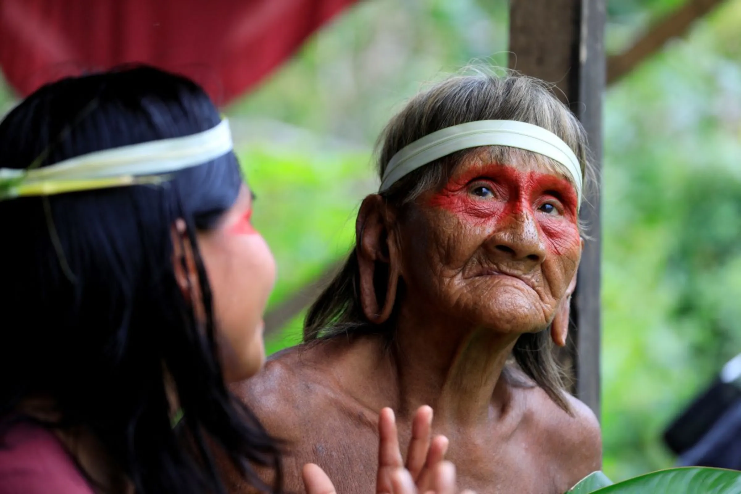 Women of the indigenous Waorani people, whose territory is the subject of a referendum vote that may ban oil production in their region, chat in the Bameno community, in the Pastaza province, in Ecuador, July 29, 2023