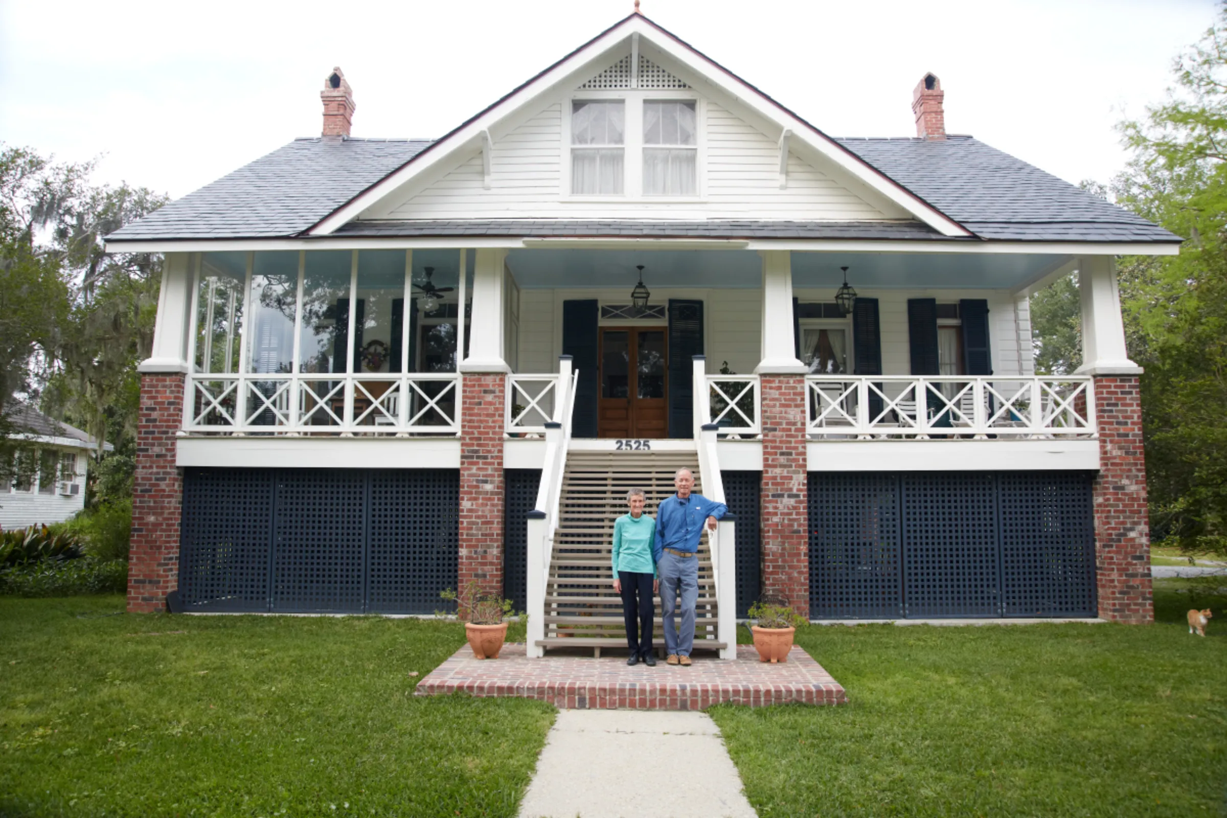 Rebecca and Leonard Rohrbough pose in front of their home in Mandeville, Louisiana, U.S., April 18, 2023