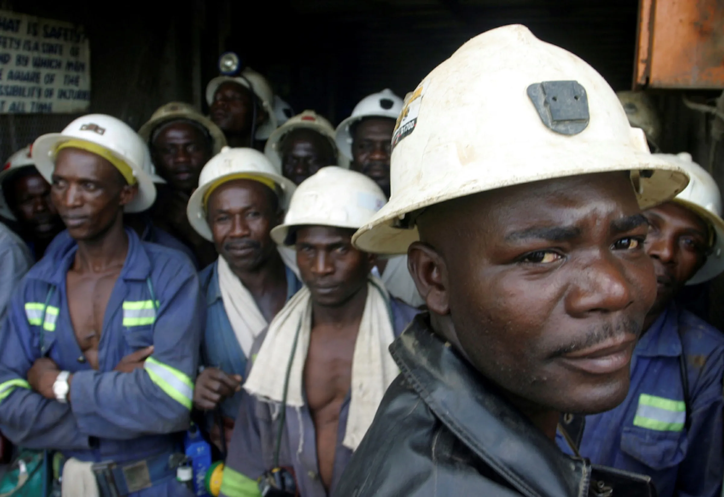 Konkola Copper Mines PLC workers wait in a lift before going to work underground in Konkola, April 12, 2005