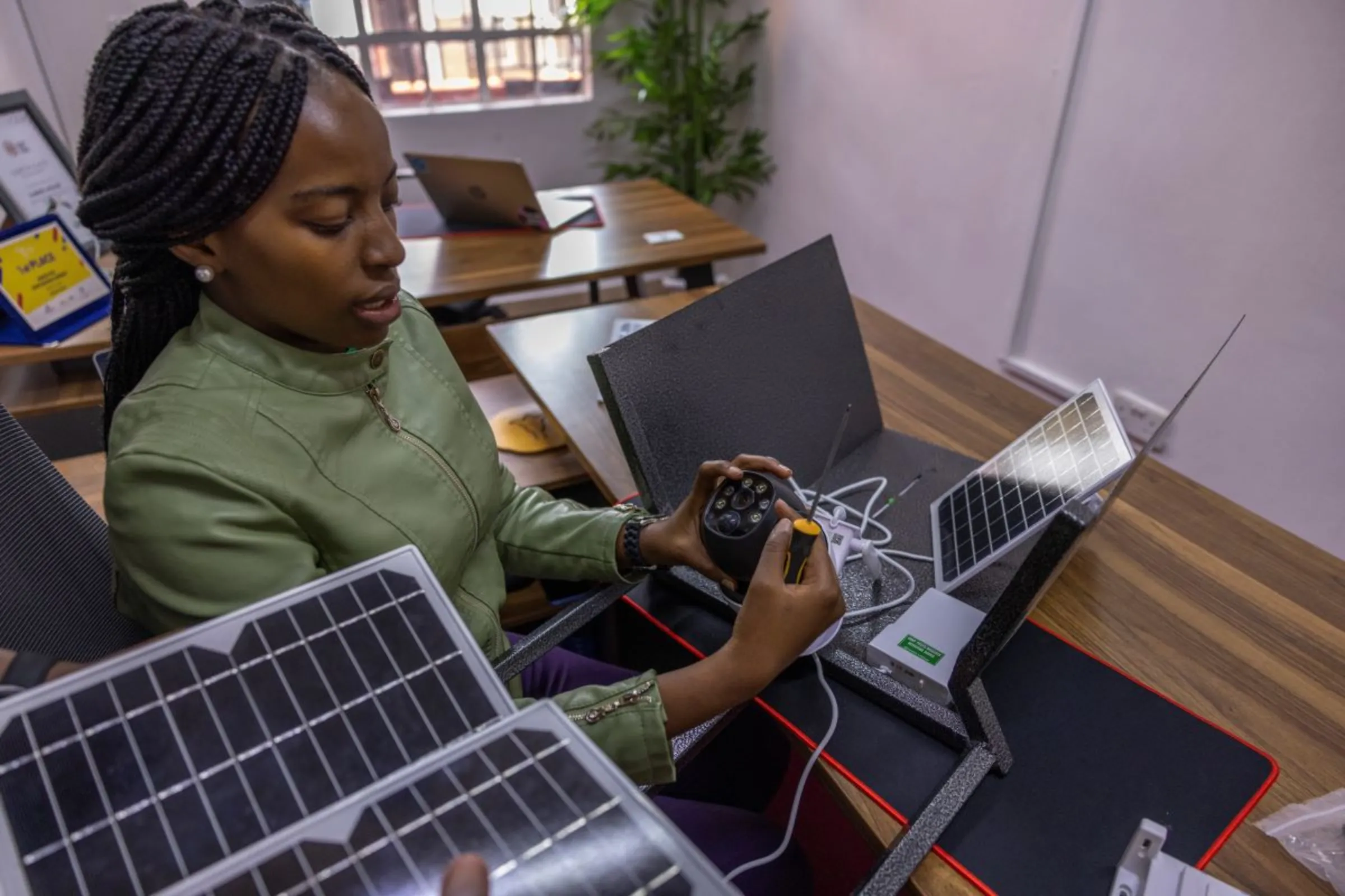 FarmerLifeline CEO and founder Esther Wanjiru and Chief Technical Officer Jack Maina assemble a crop pest detection device at their offices in Nairobi, Kenya, on November 6, 2023. Royal Academy of Engineering 2024/Handout via Thomson Reuters Foundation