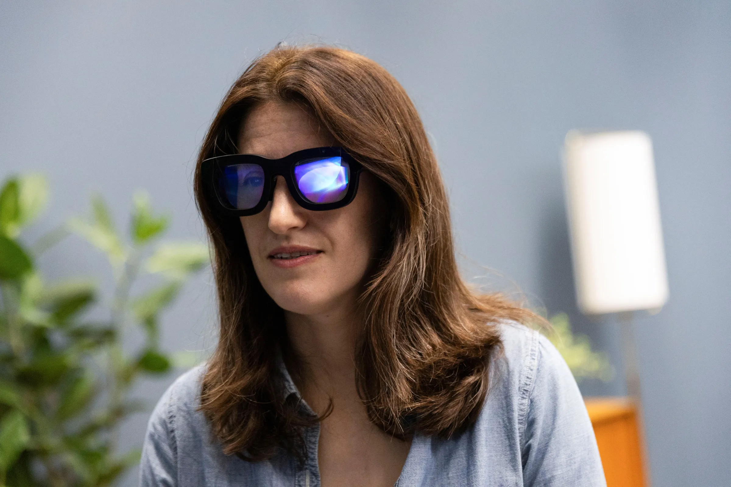 Reuters reporter Katie Paul tests Meta's Orion AR glasses during a viewing in Menlo Park, California, U.S., September 26, 2024. REUTERS/Manuel Orbegozo