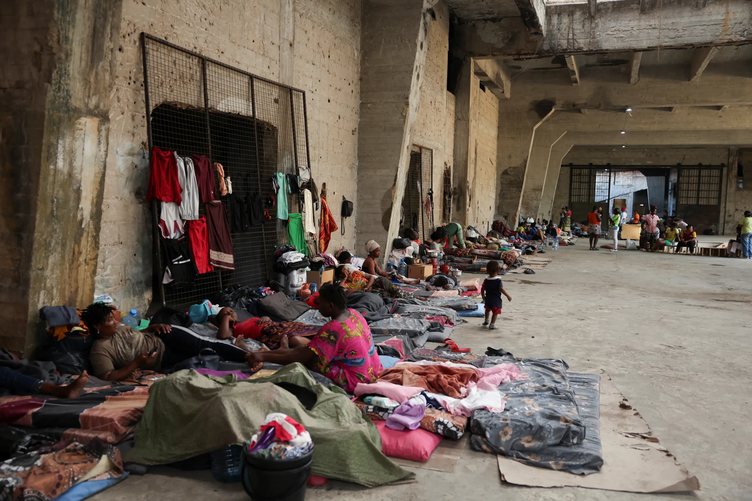 Women and children from Sierra Leone rest at a shelter for displaced migrant workers, in Hazmieh, Lebanon October 5, 2024. REUTERS/Emilie Madi