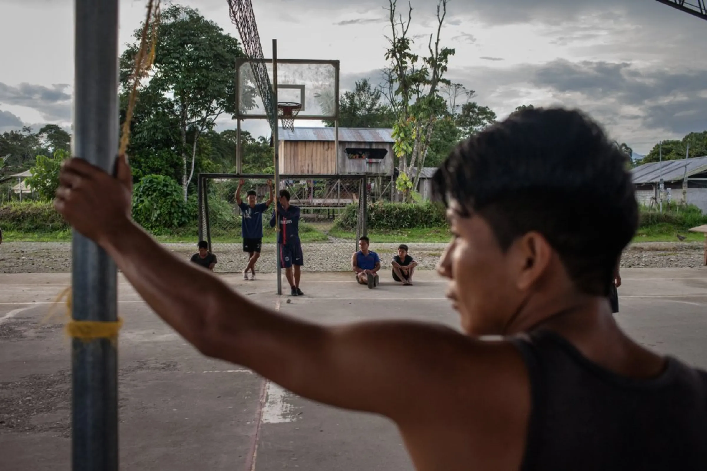 Youth from the Cofan indigenous community play volleyball at their rainforest village of Sinangoe, Ecuador, on April 21, 2022