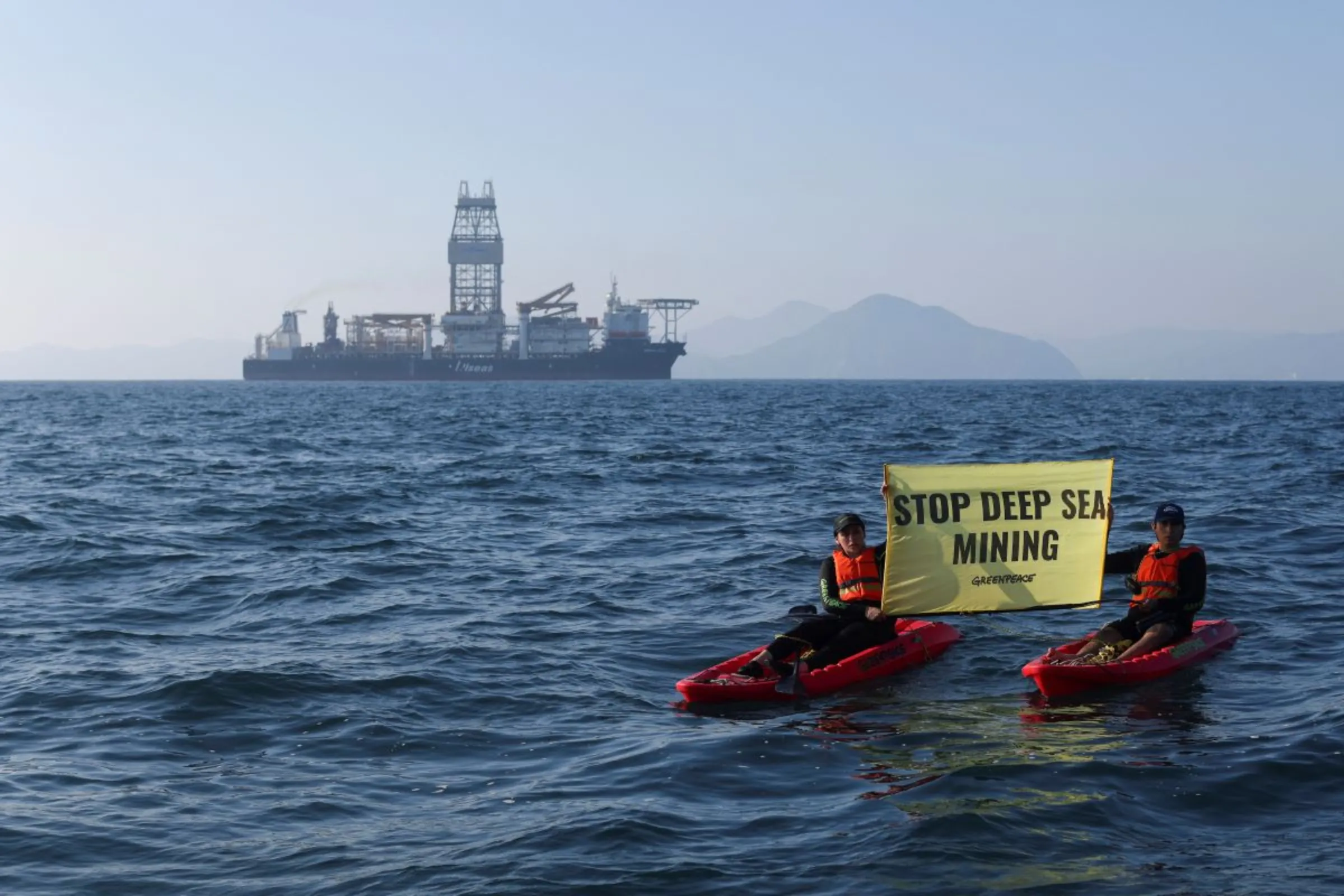 Greenpeace activists confront a deep sea mining vessel as it returned to port from eight weeks of test mining in the Clarion-Clipperton Zone between Mexico and Hawaii, off the coast of Manzanillo, Mexico November 16, 2022. REUTERS/Gustavo Graf