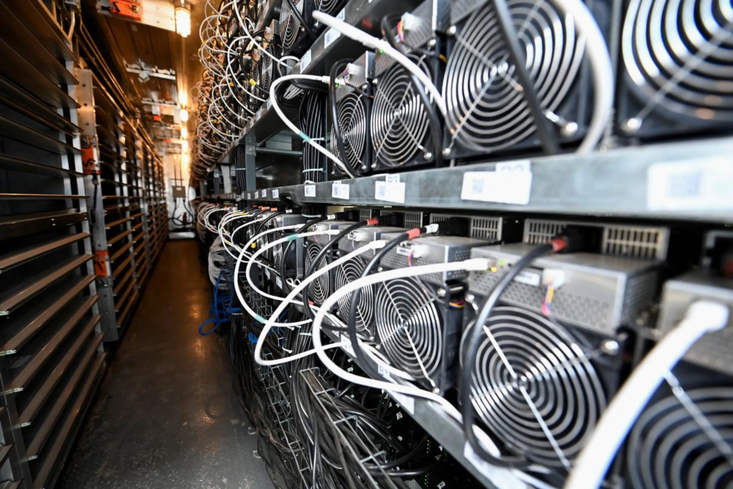A bank of cryptocurrency miners operates at the Scrubgrass Plant in Kennerdale, Pennsylvania, U.S., March 8, 2022. REUTERS/Alan Freed