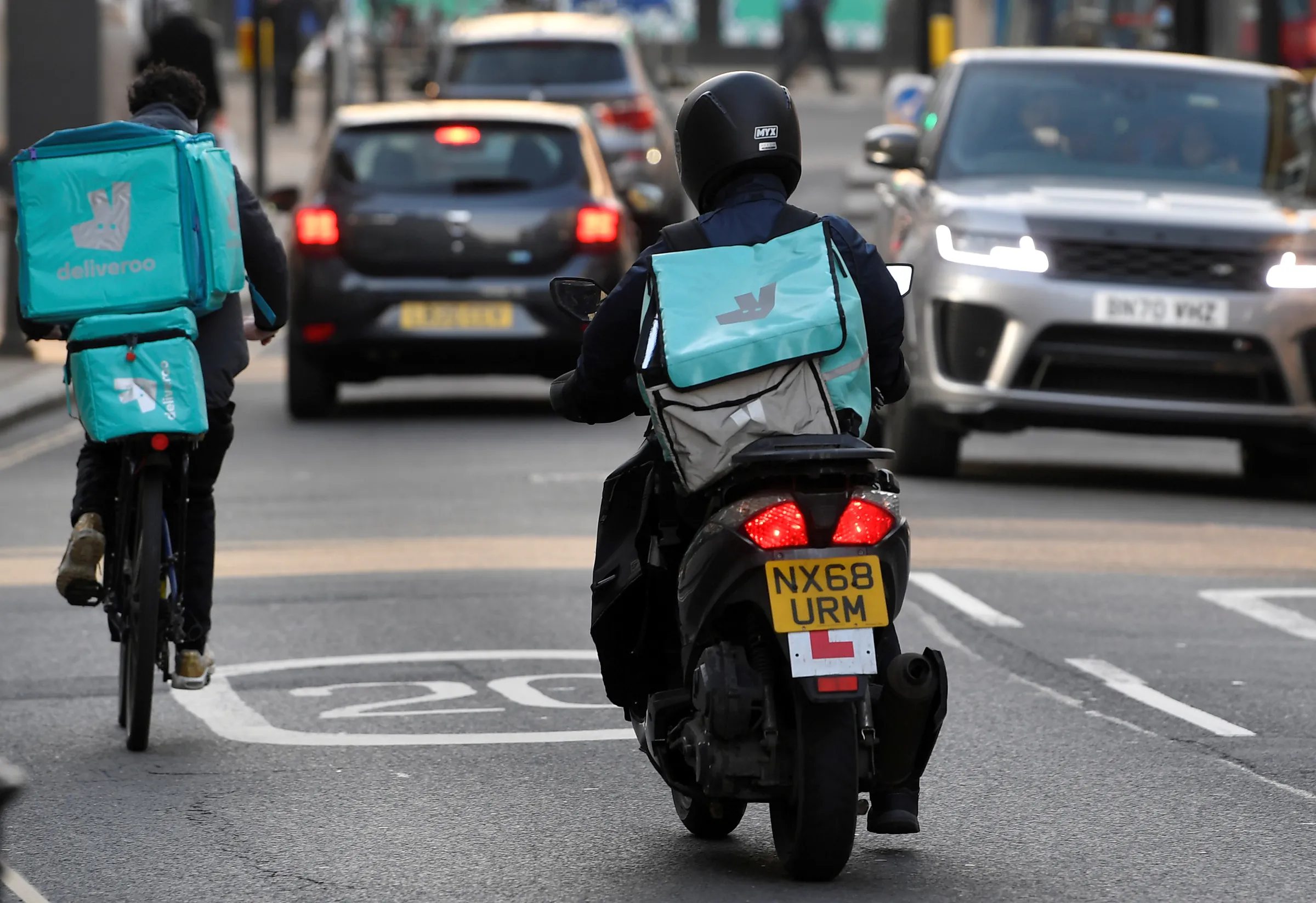 Deliveroo delivery workers ride in London, Britain, March 8, 2021