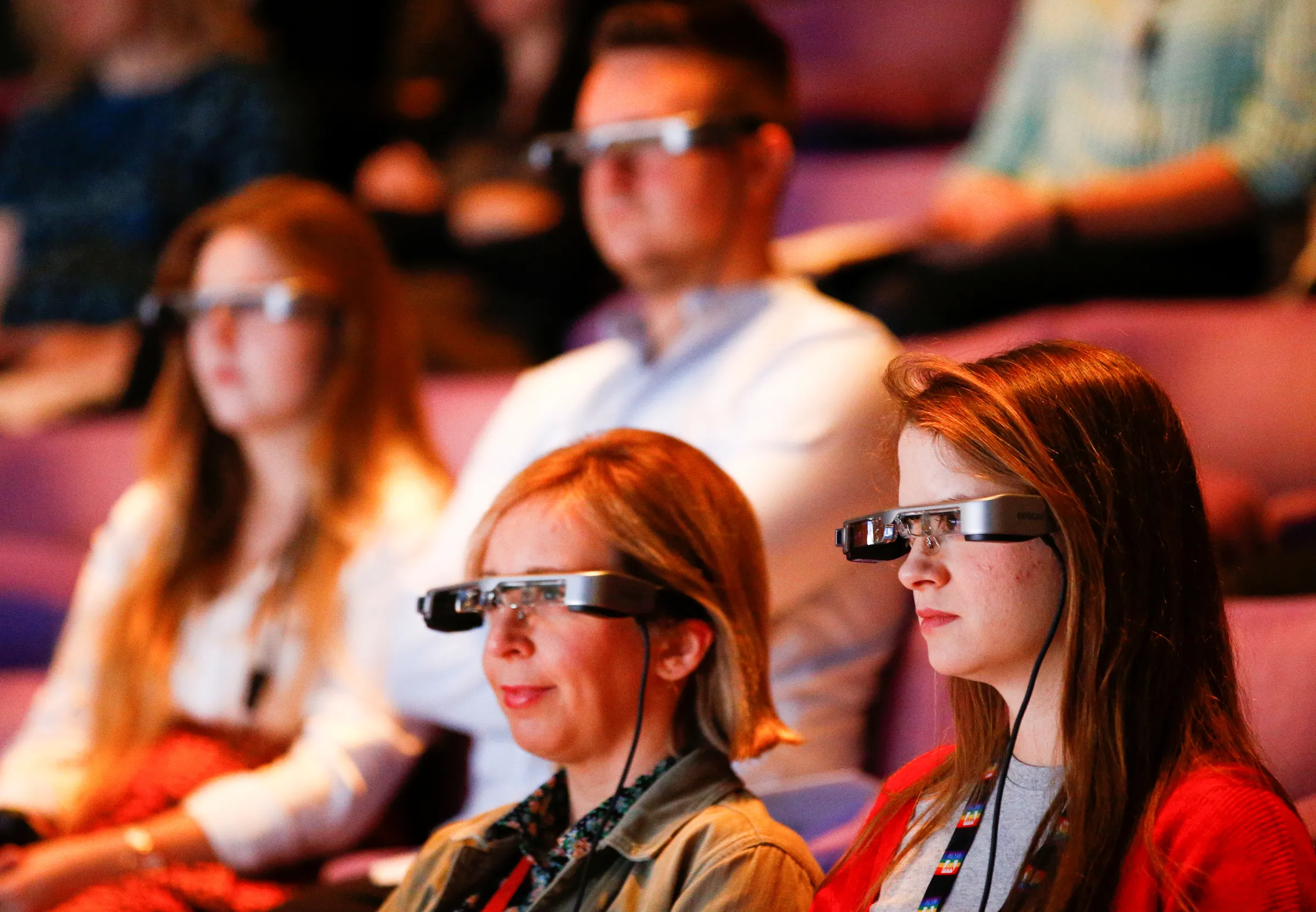 People watch a live performance of Exit the King at the National Theatre while wearing Smart Caption Glasses in London, Britain, October 3, 2018. REUTERS/Henry Nicholls