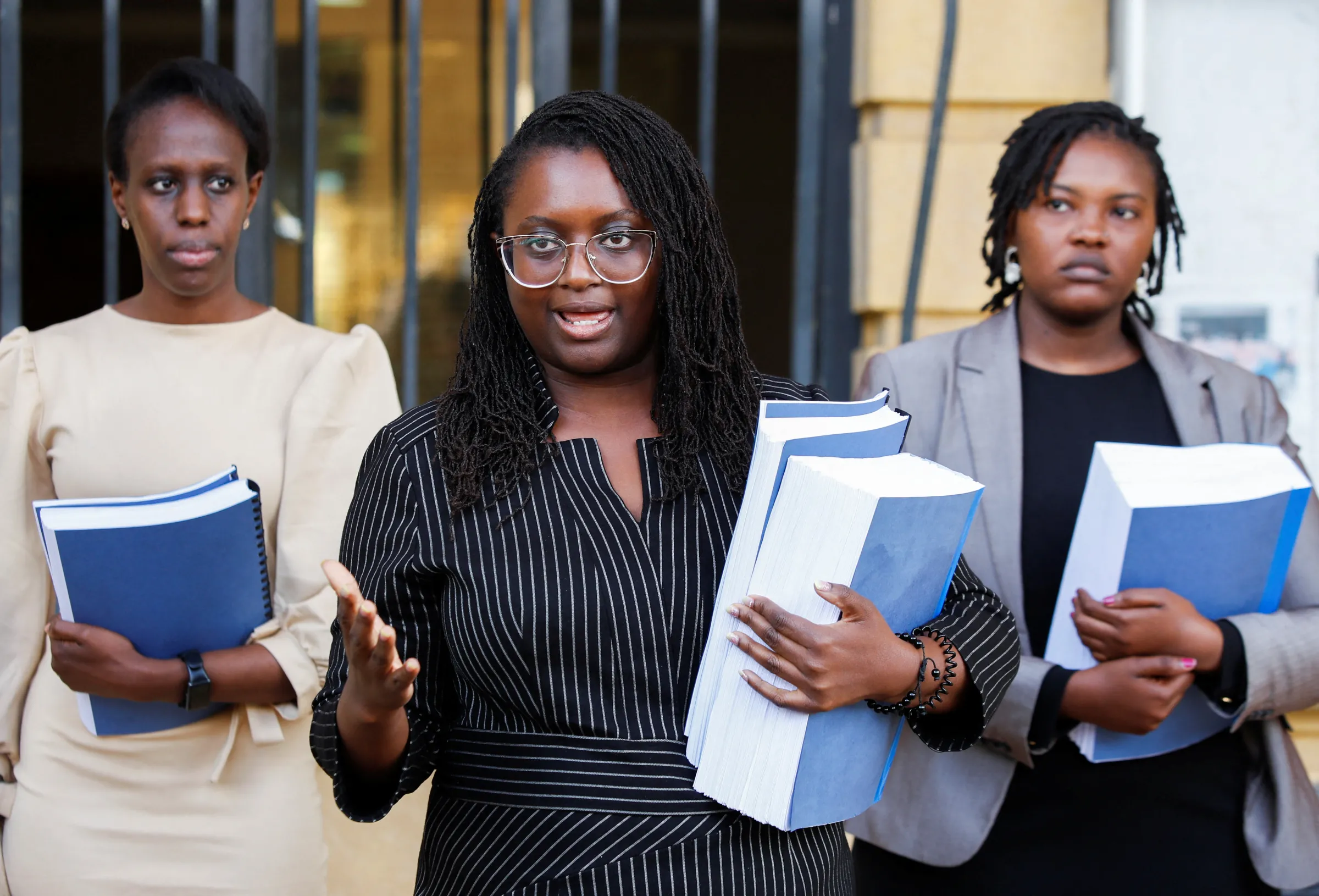 Kenyan lawyers Valerie Omari, Mercy Mutemi and Damaris Mutemi addresses a news conference after filing a lawsuit on behalf of their clients accusing Meta of enabling hateful posts on Ethiopia conflict at the Milimani Law Courts in Nairobi, Kenya December 14, 2022. REUTERS/Monicah Mwangi