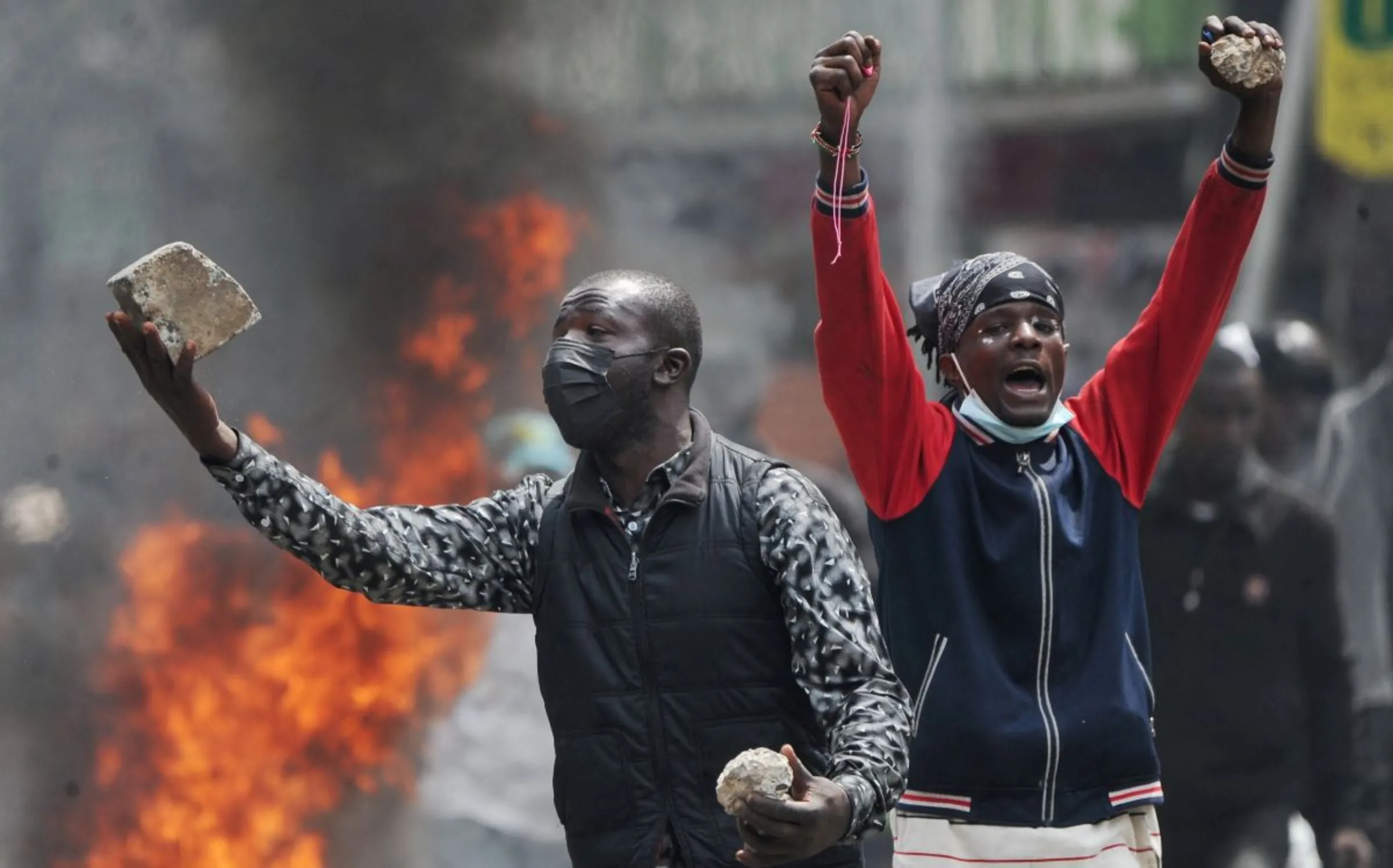 Protesters hold stones during a demonstration over police killings of people protesting against the imposition of tax hikes by the government, in Nairobi, Kenya, July 2, 2024. REUTERS/John Muchucha