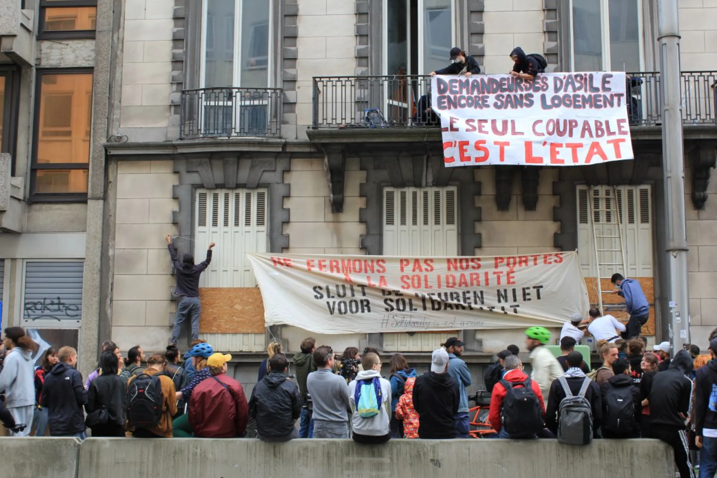 Homeless asylum seekers and citizens demonstrate against eviction from Brussels squat. Belgium August 31 2023