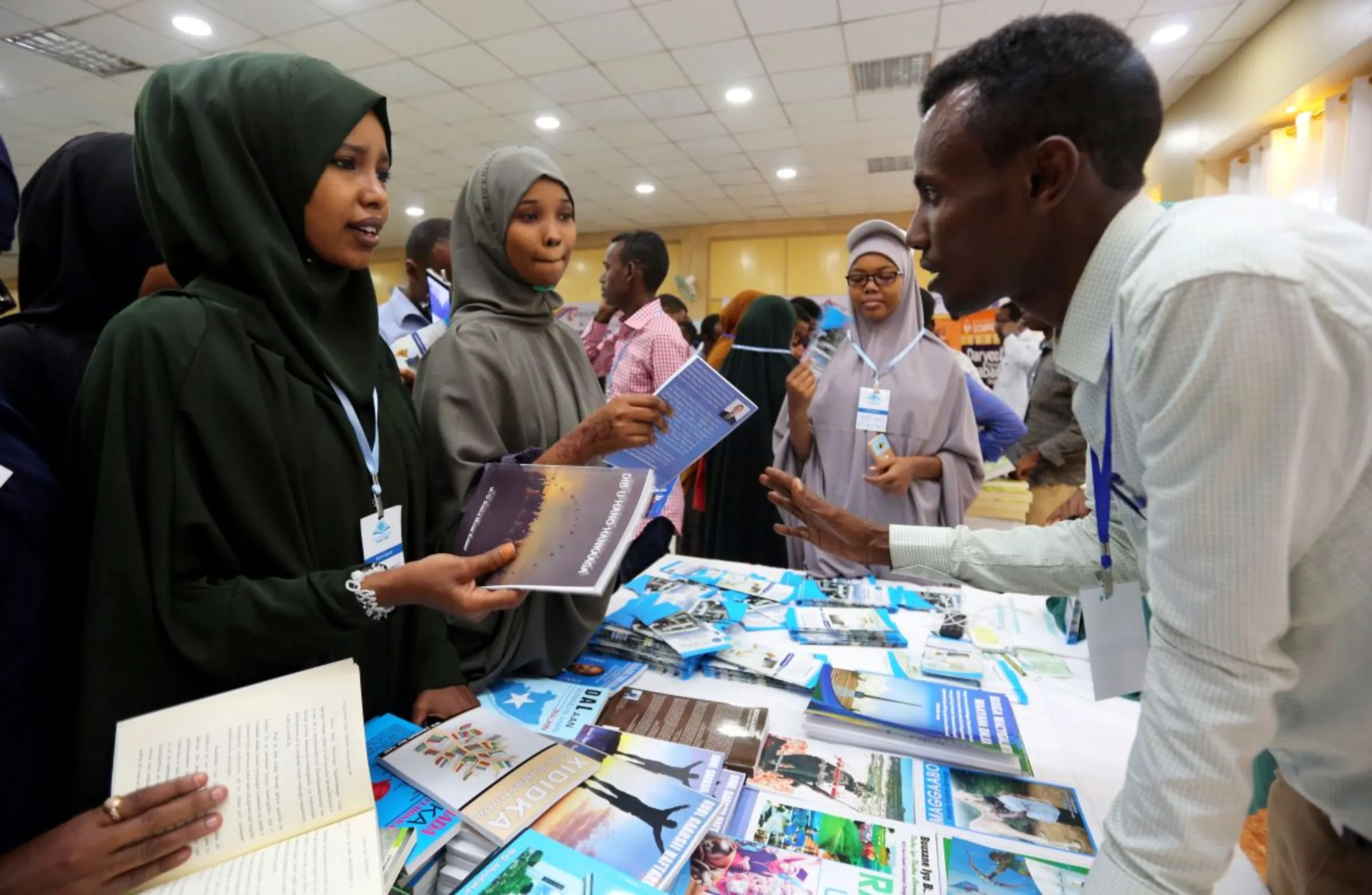 People browse through books during the third annual book fair in Mogadishu, Somalia September 14, 2017. REUTERS/Feisal Omar