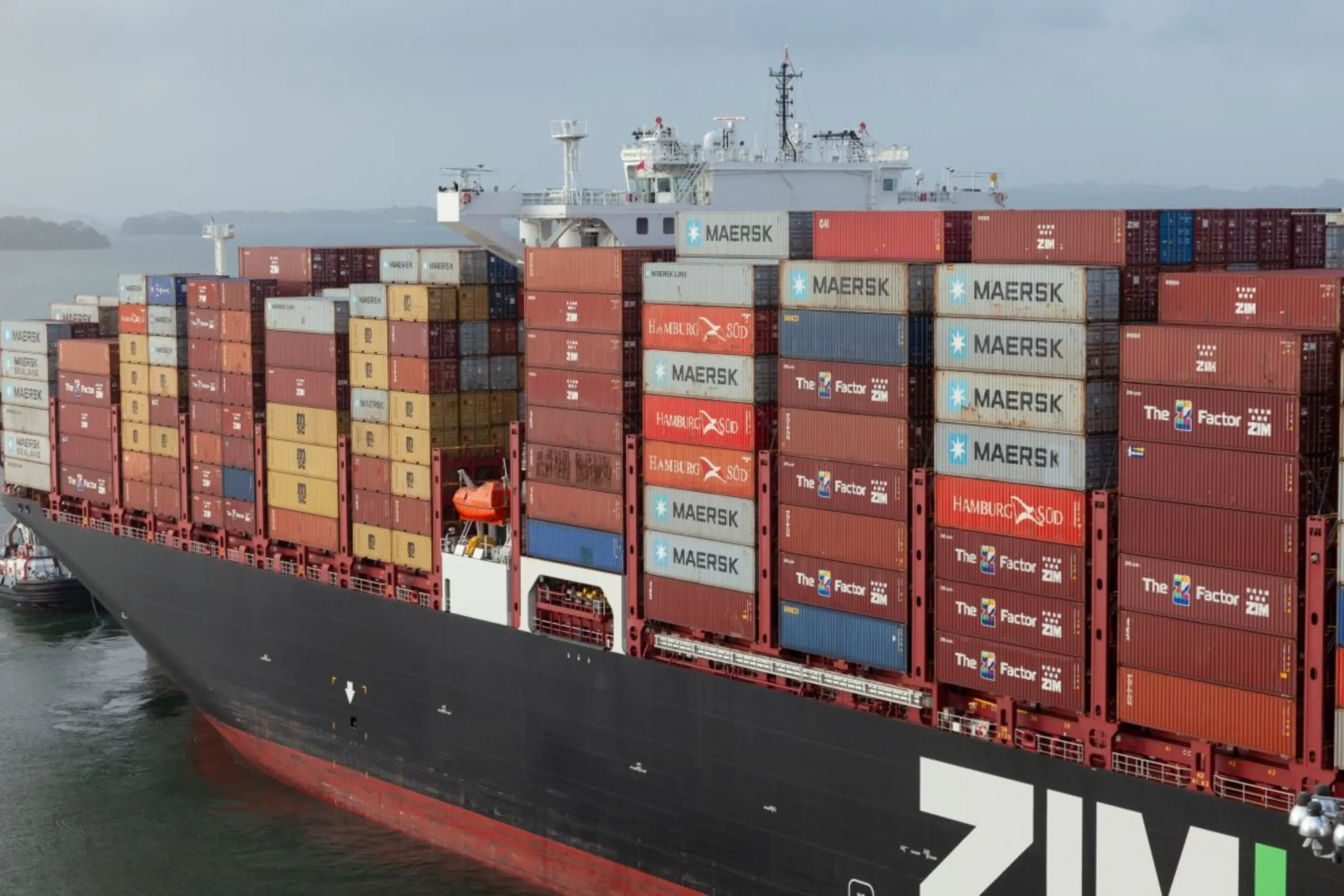 A container ship transits through Gatún Lake, the main rainfall-fed reservoir that feeds the Panama Canal locks, Panama, February 16, 2024. Thomson Reuters Foundation/Enea Lebrun.