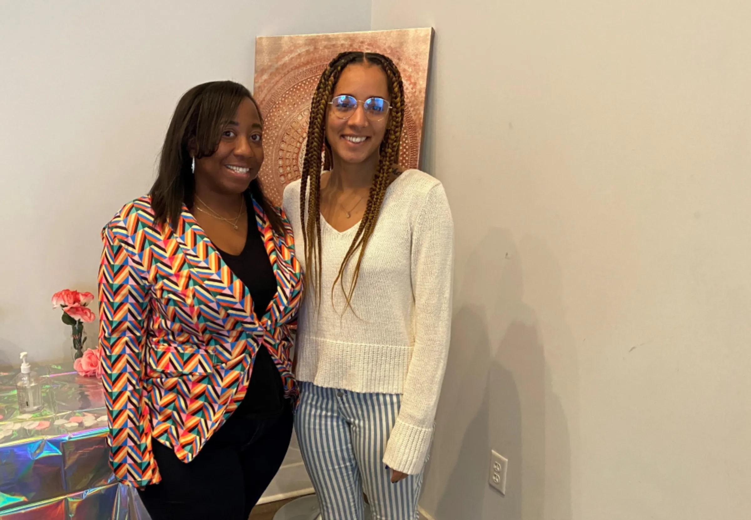 Kenda Sutton-EL, executive director of Birth in Color RVA (L), poses for a photo with Sequoi Phipps-Hawkins, the group’s director of communications and marketing (R), at the nonprofit organization’s office in Richmond, Virginia, U.S., February 27, 2023